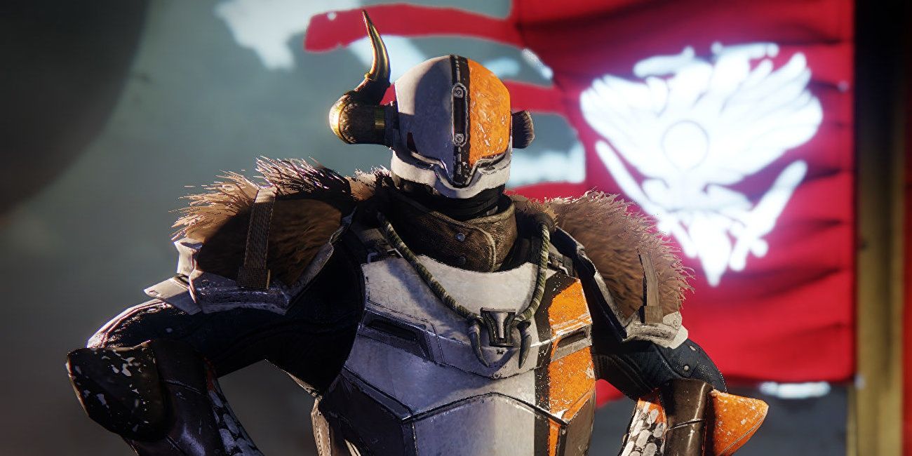 shaxx standing proudly by banner