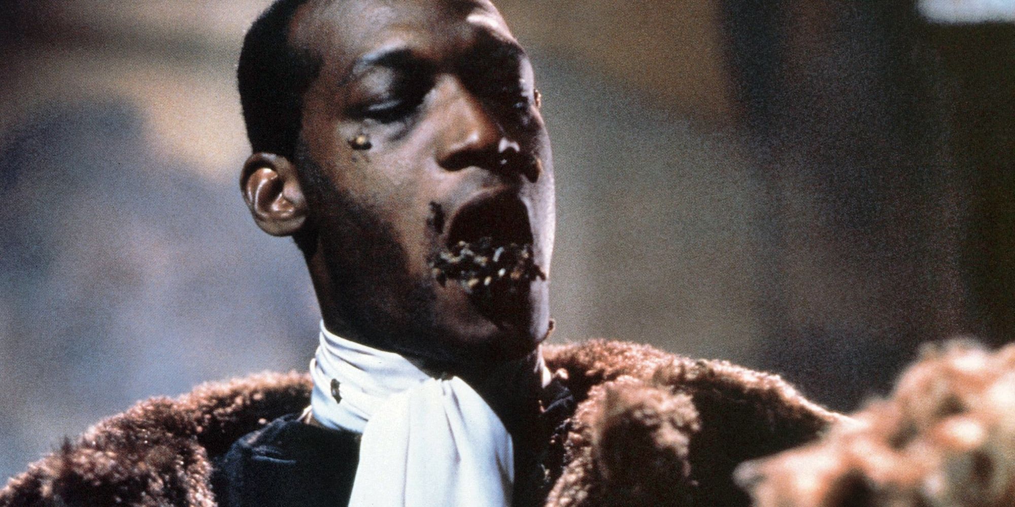 Photo from the 1992 Candyman. A man has bees in his mouth.