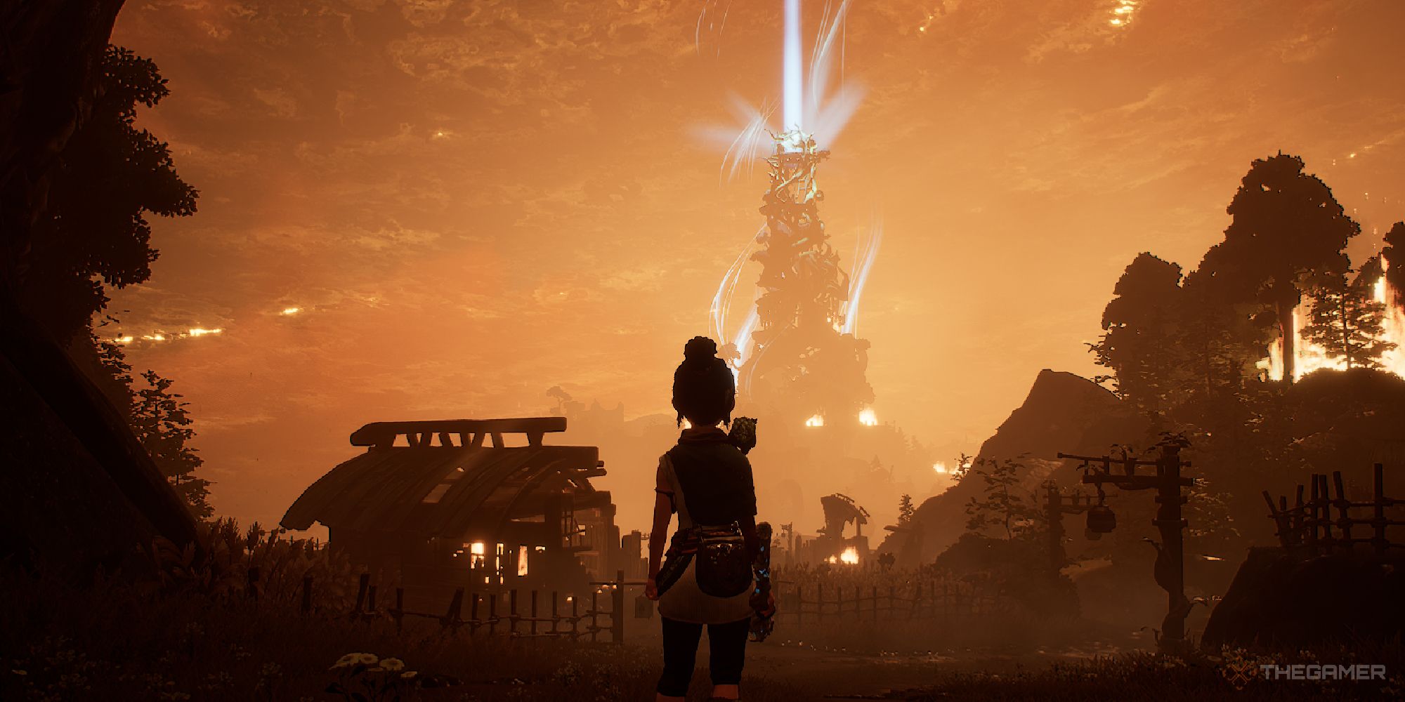 Kena entering Fields, staring at the giant burning tower