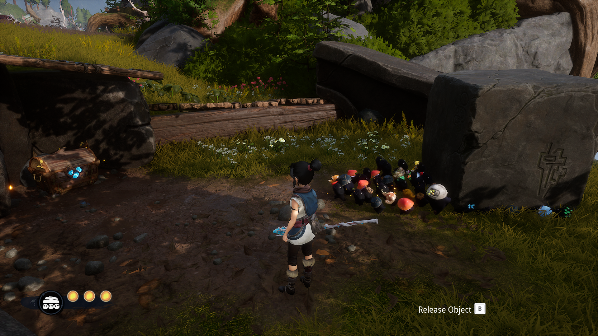 Kena watching Rots move a boulder away from a chest