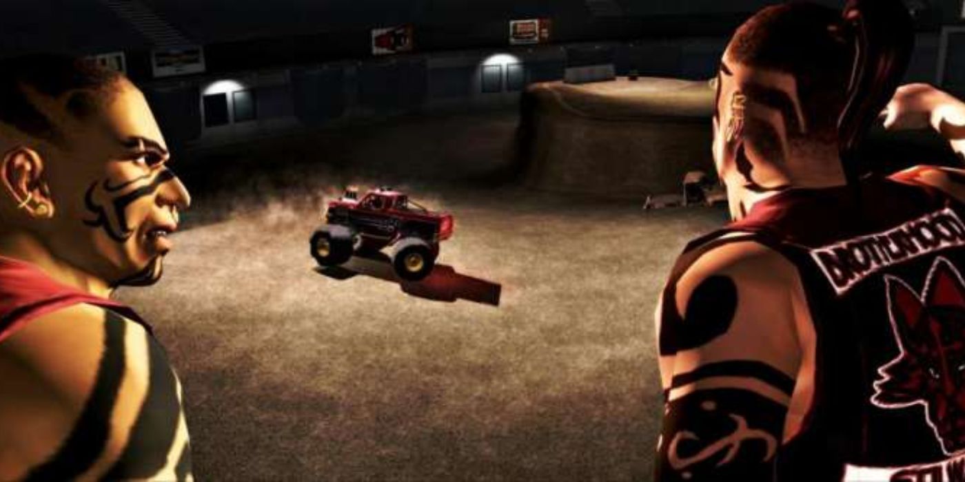 Two members of the Brotherhood watch Maero go to work in his monster truck