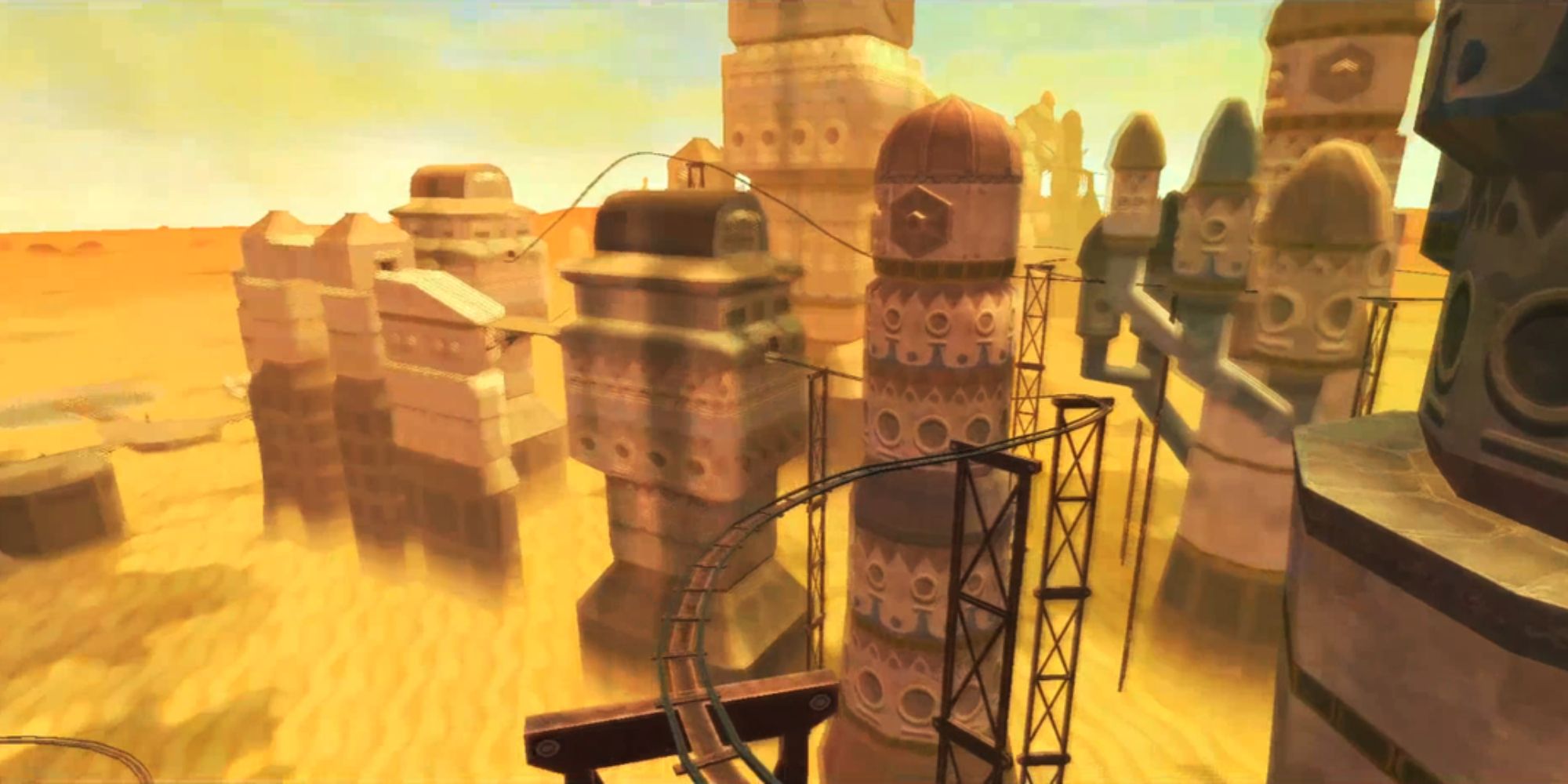 The Legend Of Zelda Locations wide shot of dust engulfed buildings and elevated rail track running over sand dunes in the Shipyard