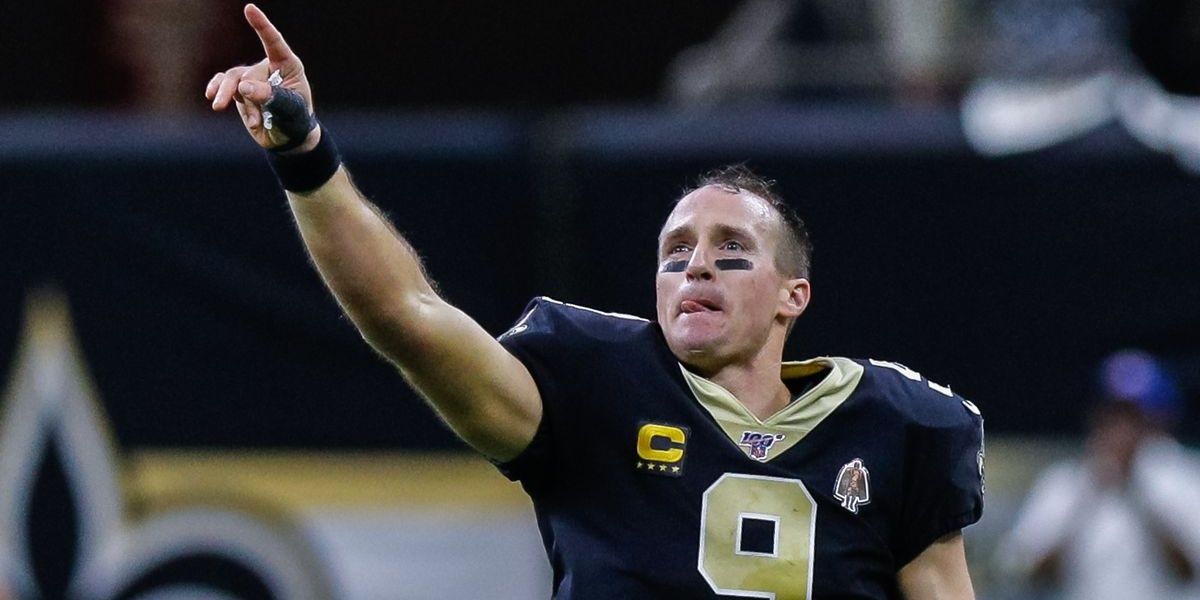 drew brees with hand raised