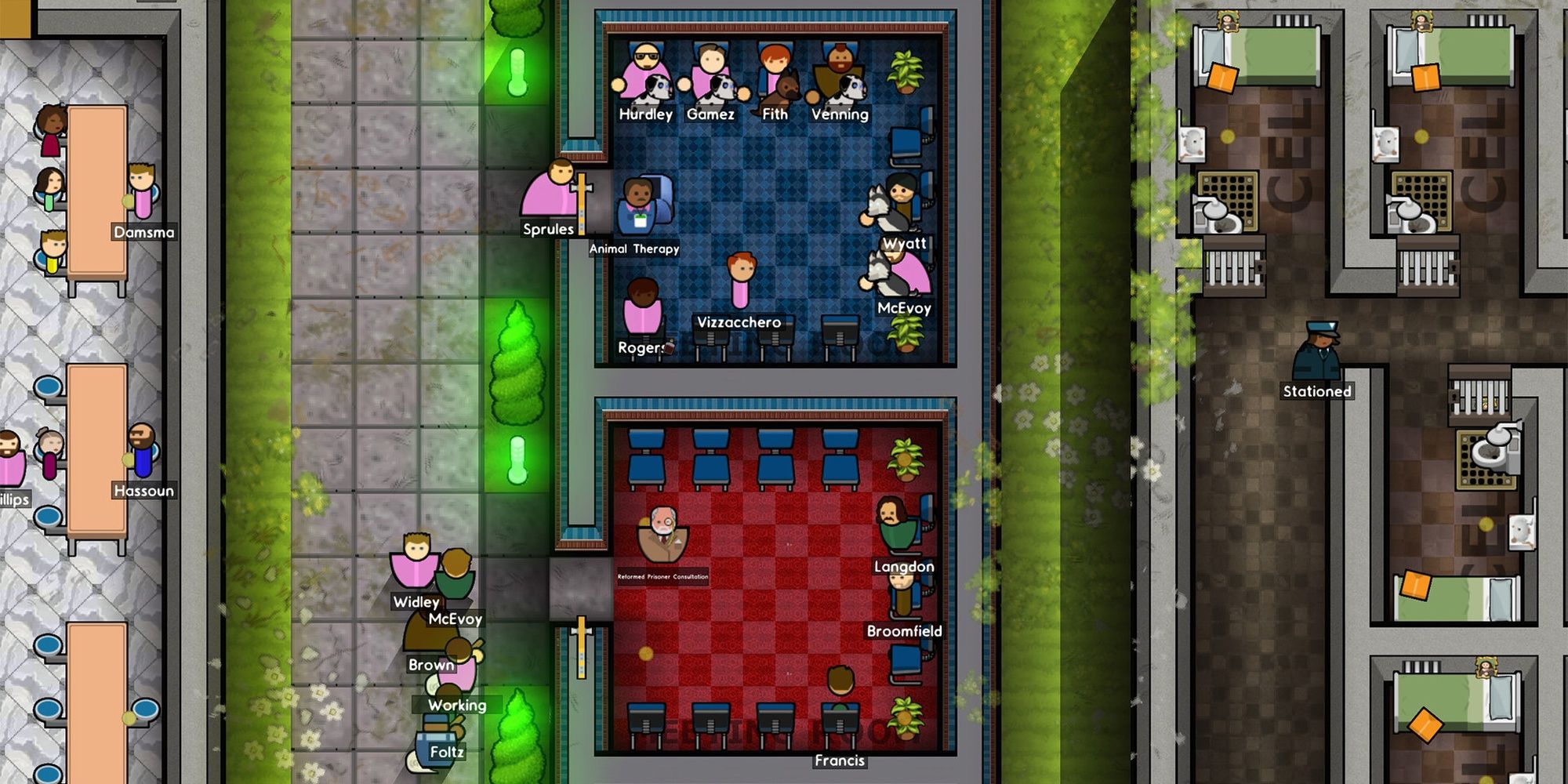 An overhead view of prisoners in adjacent rooms and walking around.