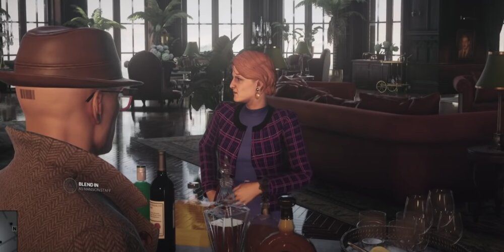 A Screenshot Of Hitman 3 Gameplay, Emma Carlisle Poisoning Alexa Carlisle's Drink 