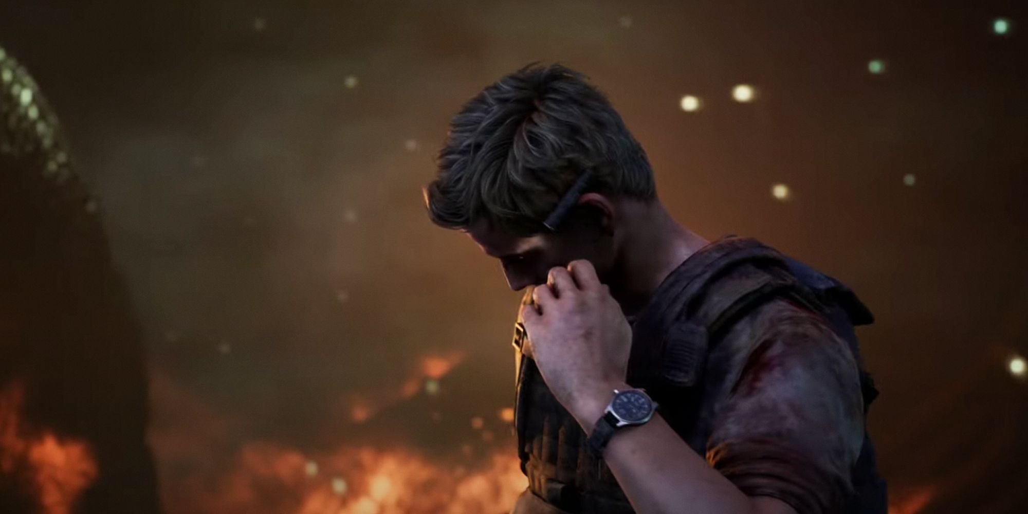 House Of Ashes. Eric holding his finger up to his ear as he's receiving a radio signal. Fire in the background.
