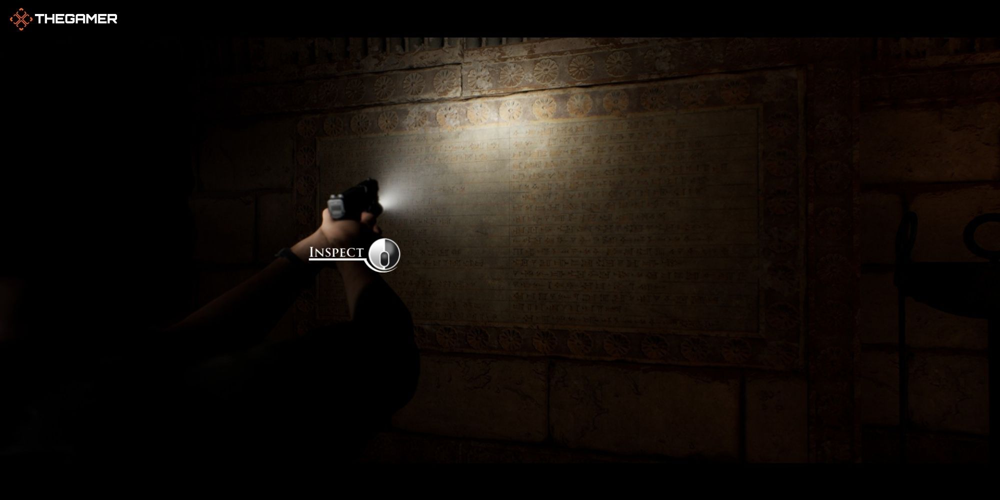House of Ashes - Pazuzu - Eric next to a stone engraving