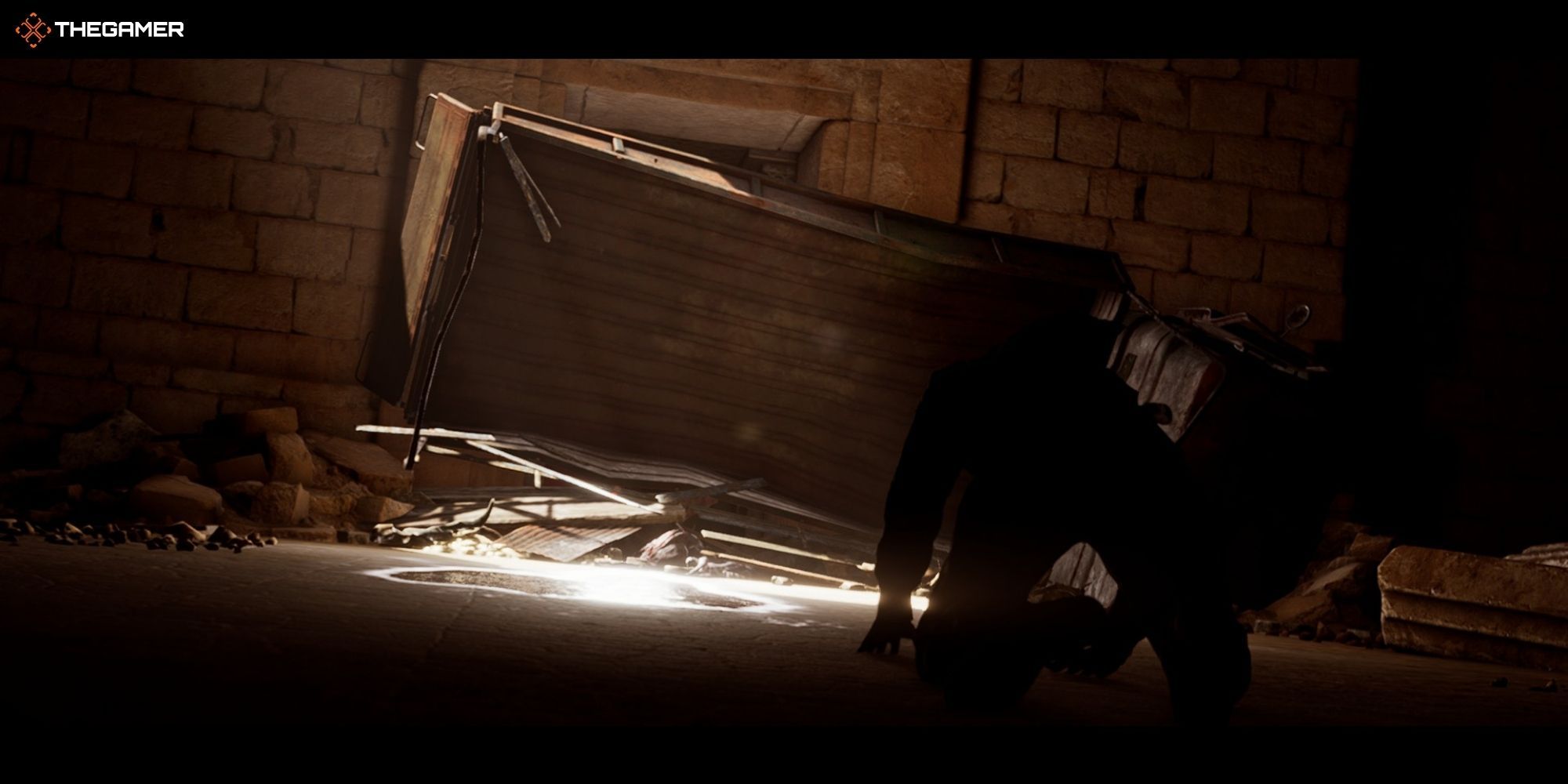House of Ashes - Pazuzu - Salim laughing in front of the creature under a truck