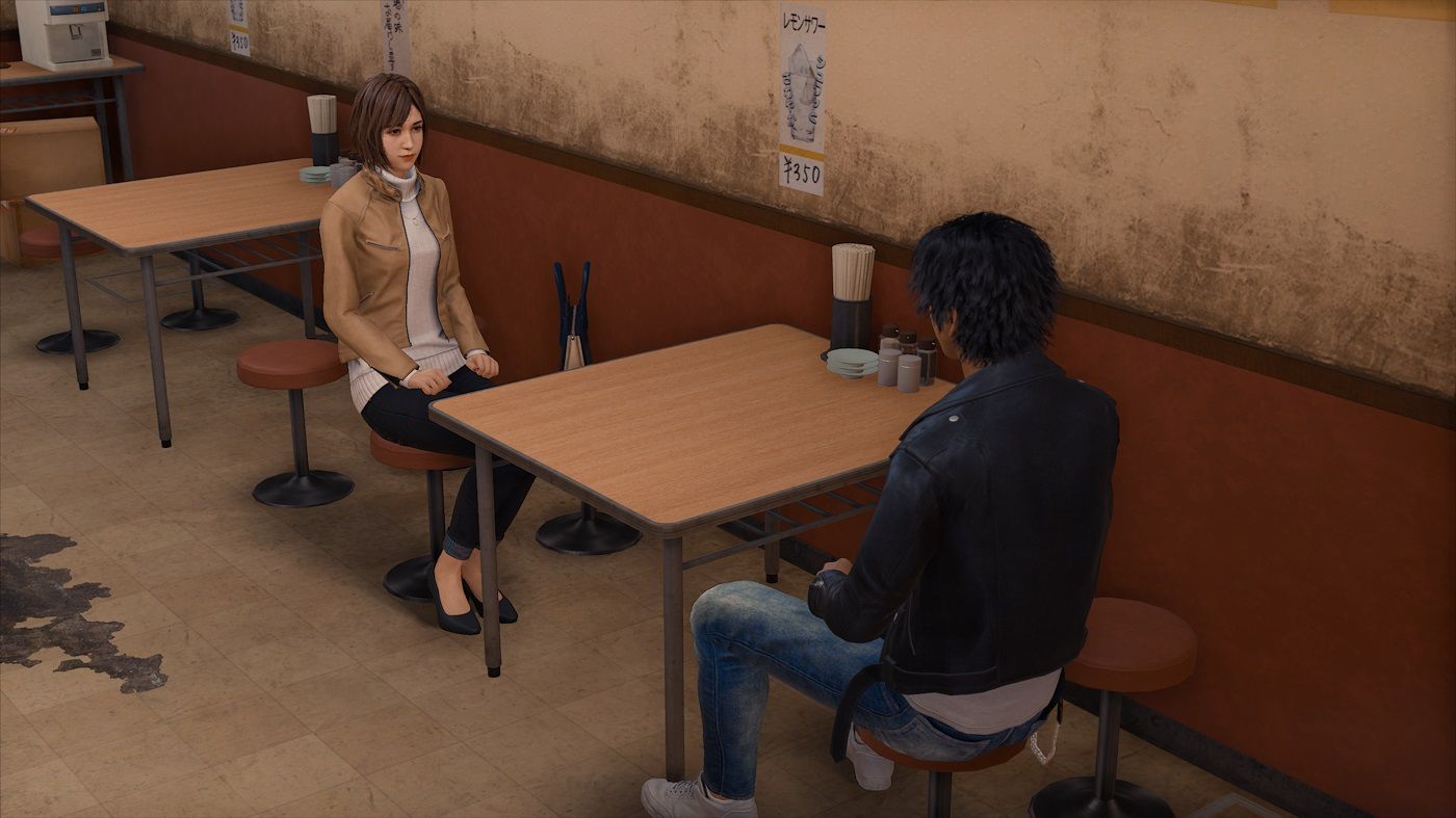 Lost Judgment Yagami and Emily in a cafe