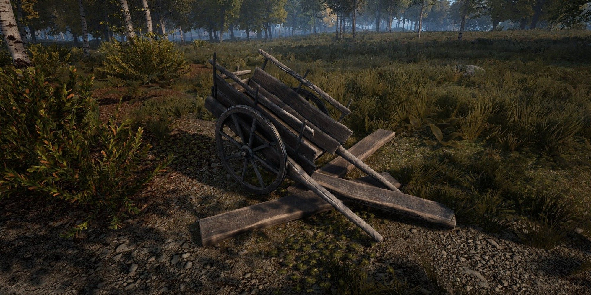 broken cart with planks laying on ground