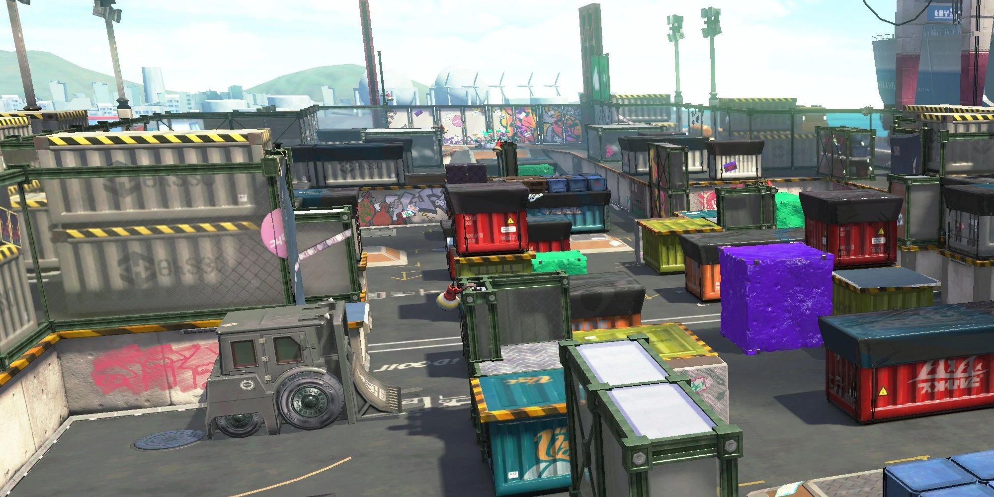 Shipping containers and inky sponges on the Port Mackerel map from Splatoon 2