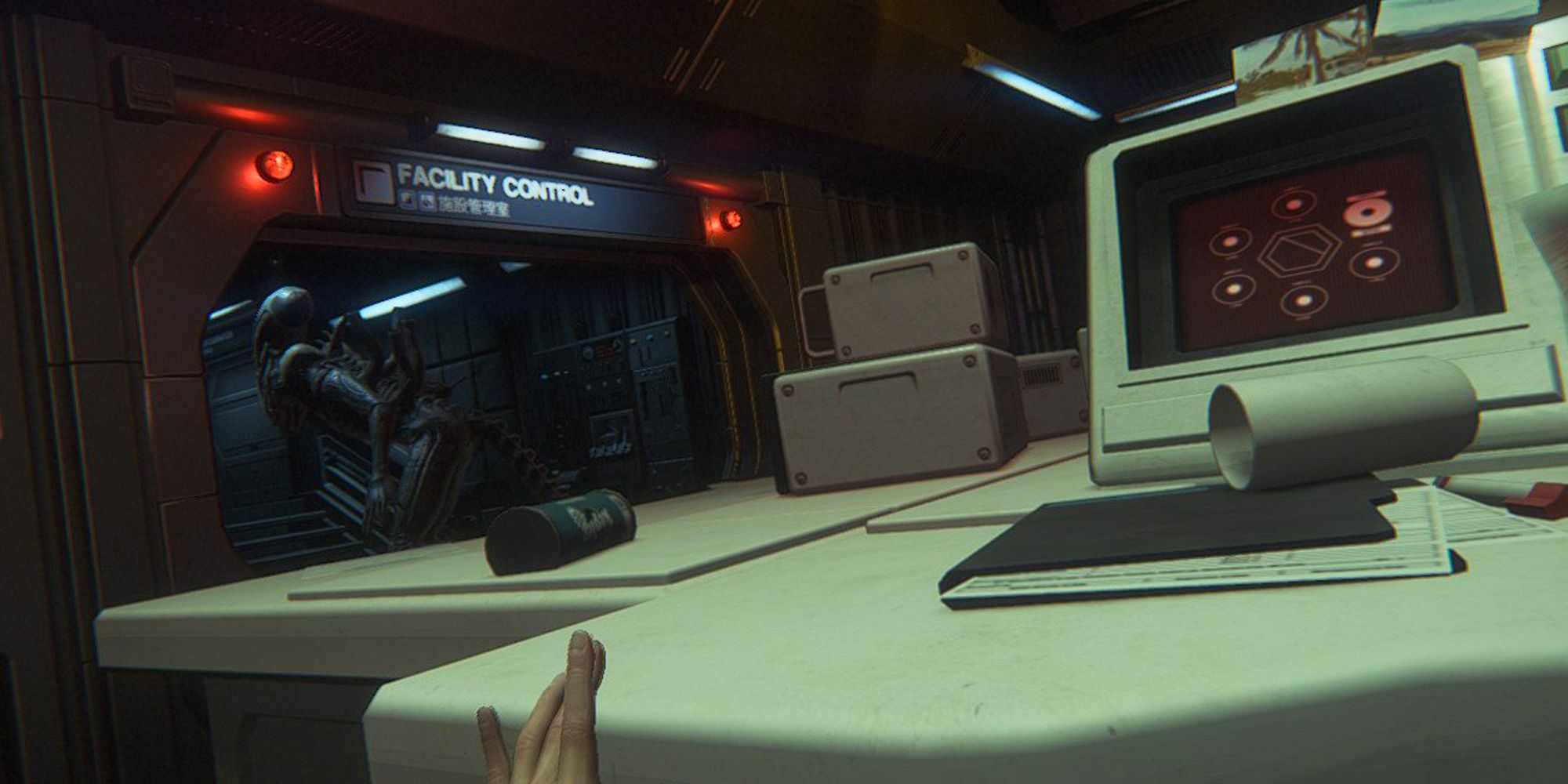 Alien Isolation. Alien walking out of room as Ripley hides away from it behind a desk.