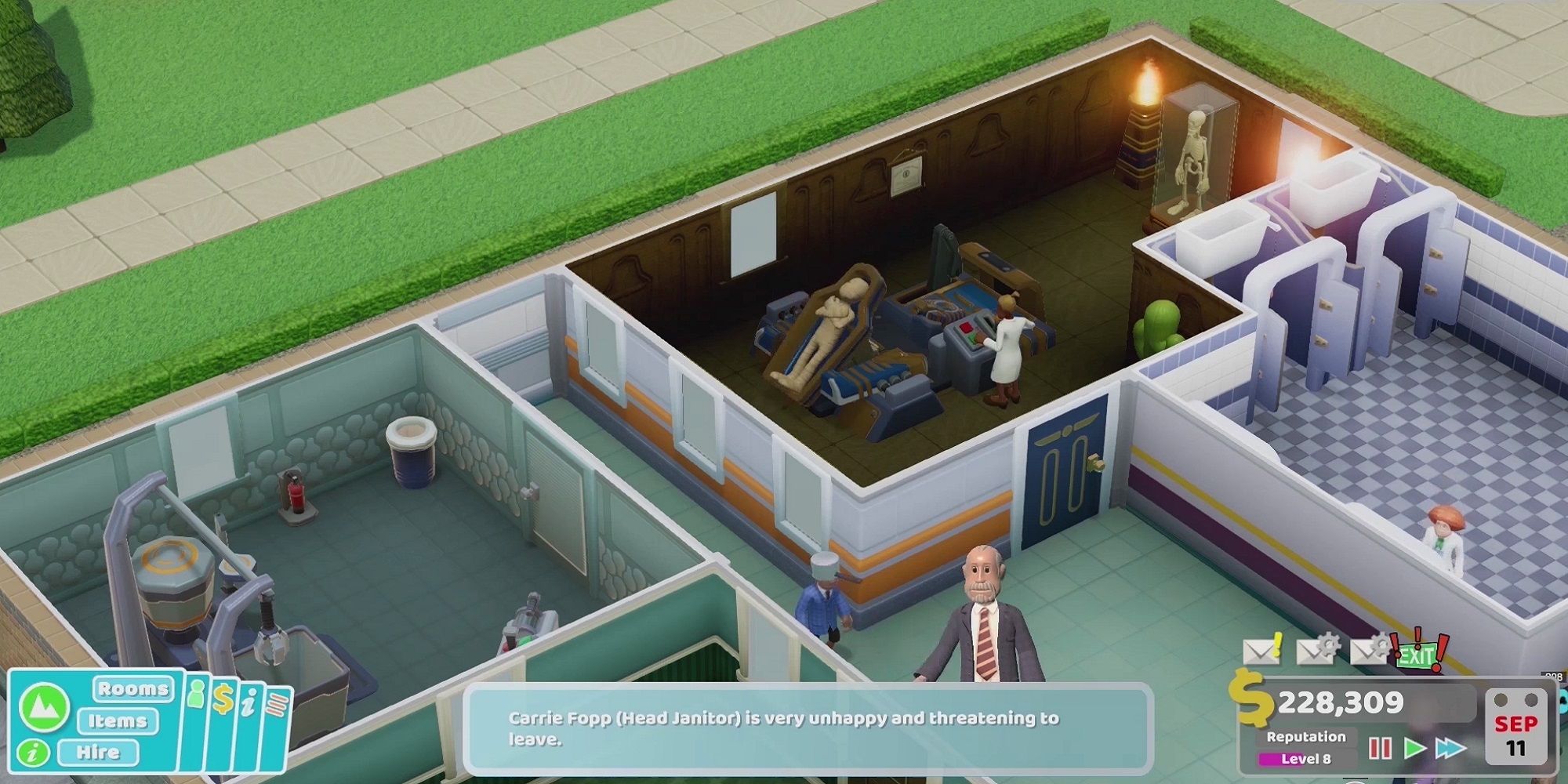 Two Point Hospital screenshot showing a section of a hospital with a number of treatment rooms