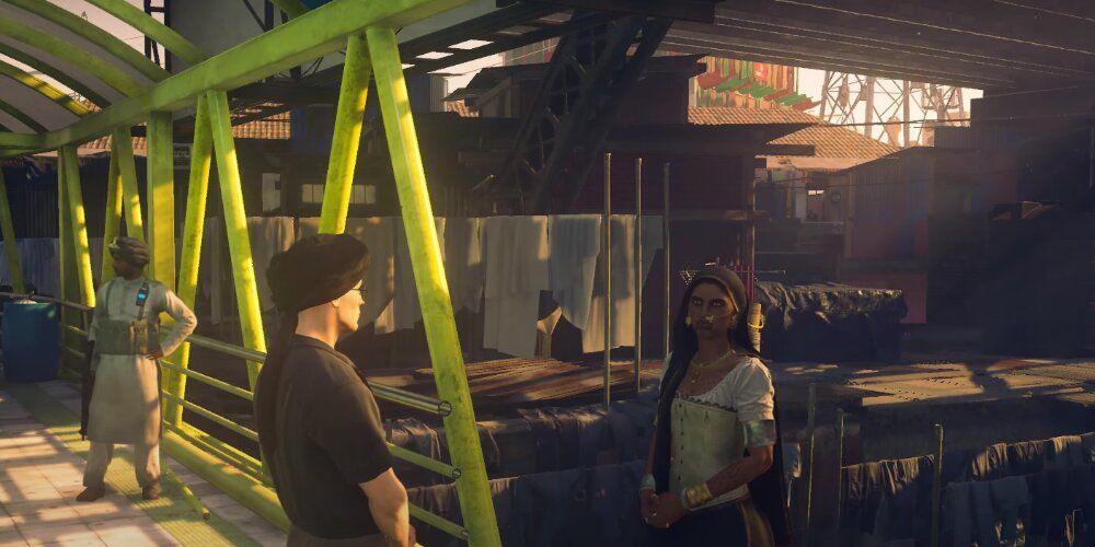 A Screenshot Of Agent 47 In Dialogue With Vanya Shah In Hitman's Mumbai Map.