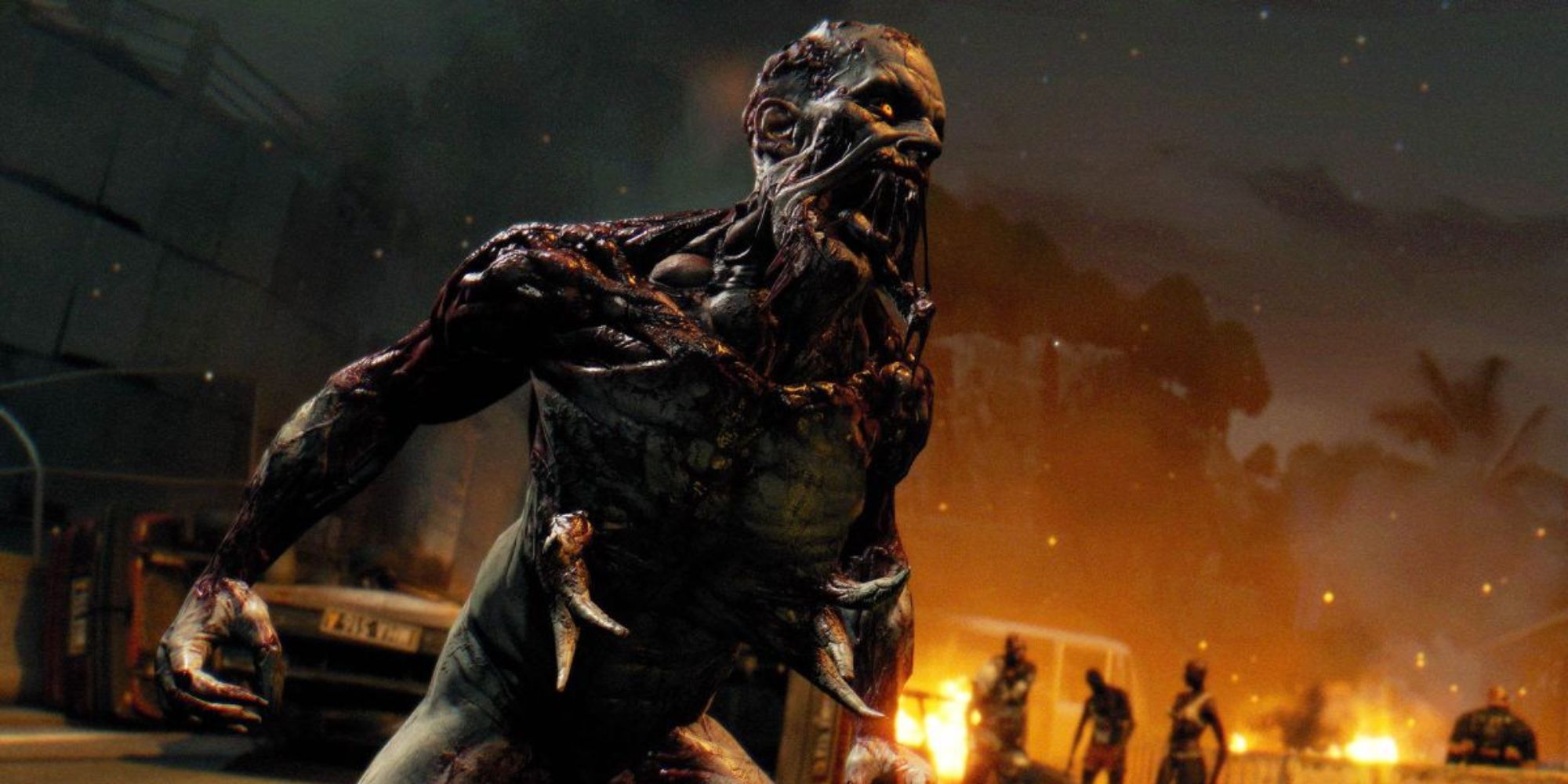 dying light zombie tensing up in front of burning vehicles