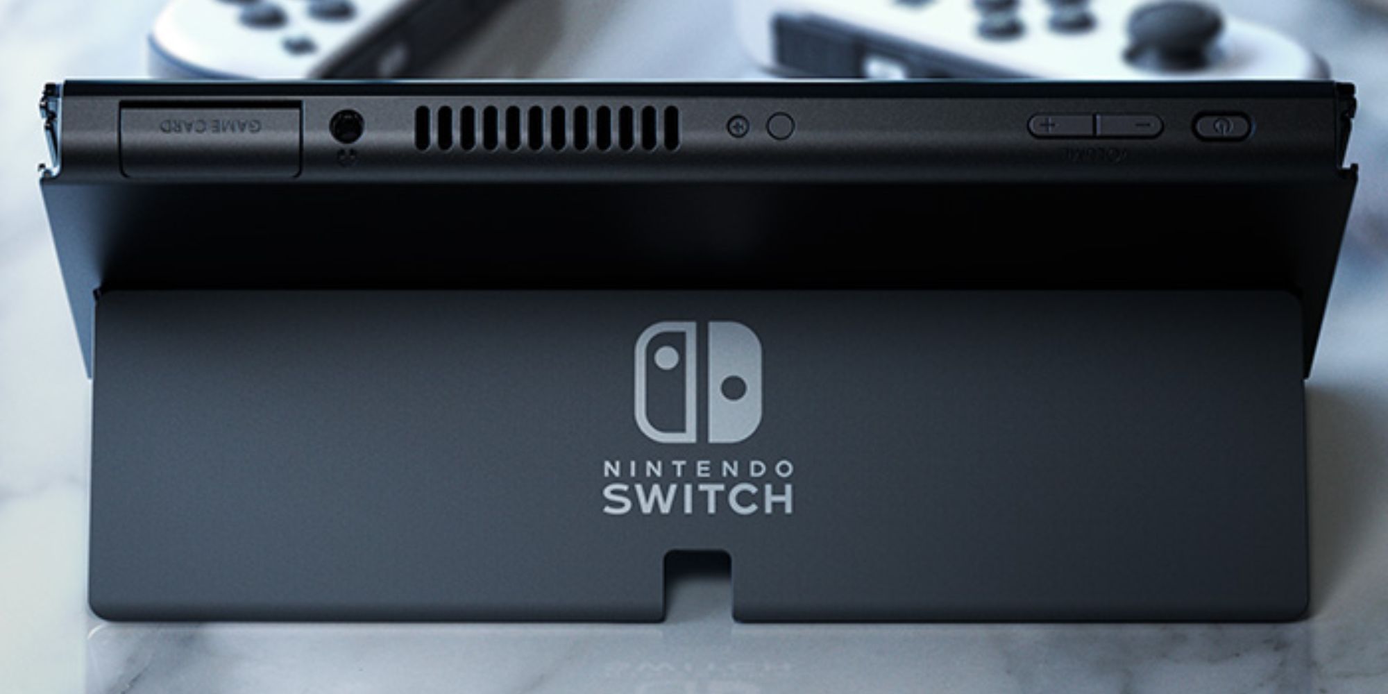 Switch OLED on kickstand showing off buttons
