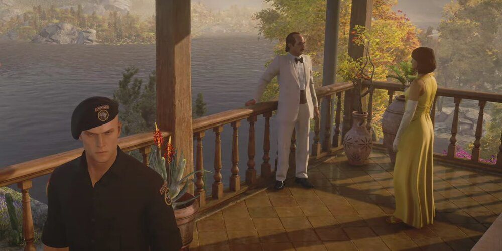 A Screenshot From Hitman 3's Mendoza Map Showing Don Yates And His Wife Valentina In Conversation.