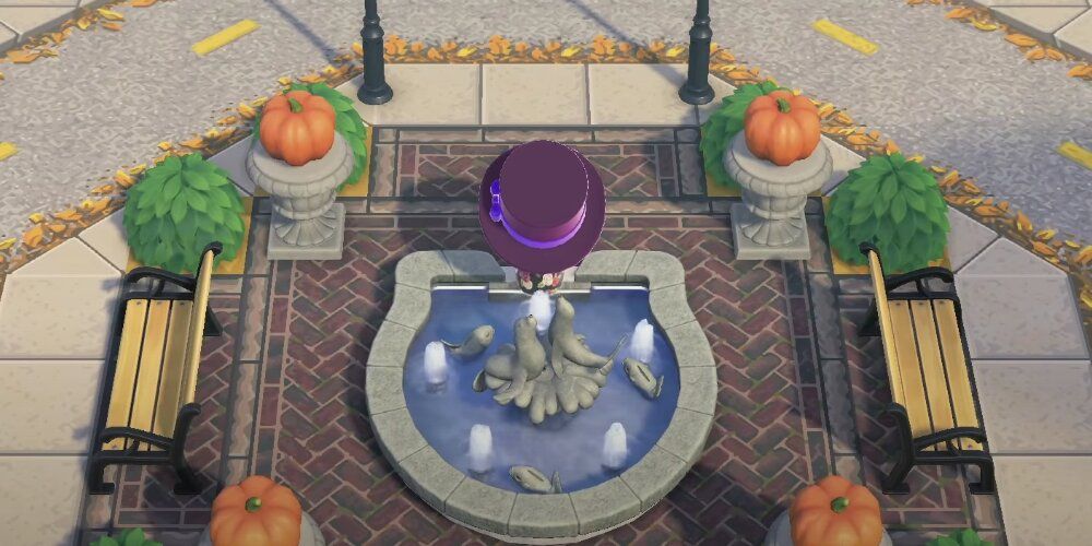 A Screenshot From Game Play Of A Player's Island In Animal Crossing Showing Their Use Of The Park Fountain Item.
