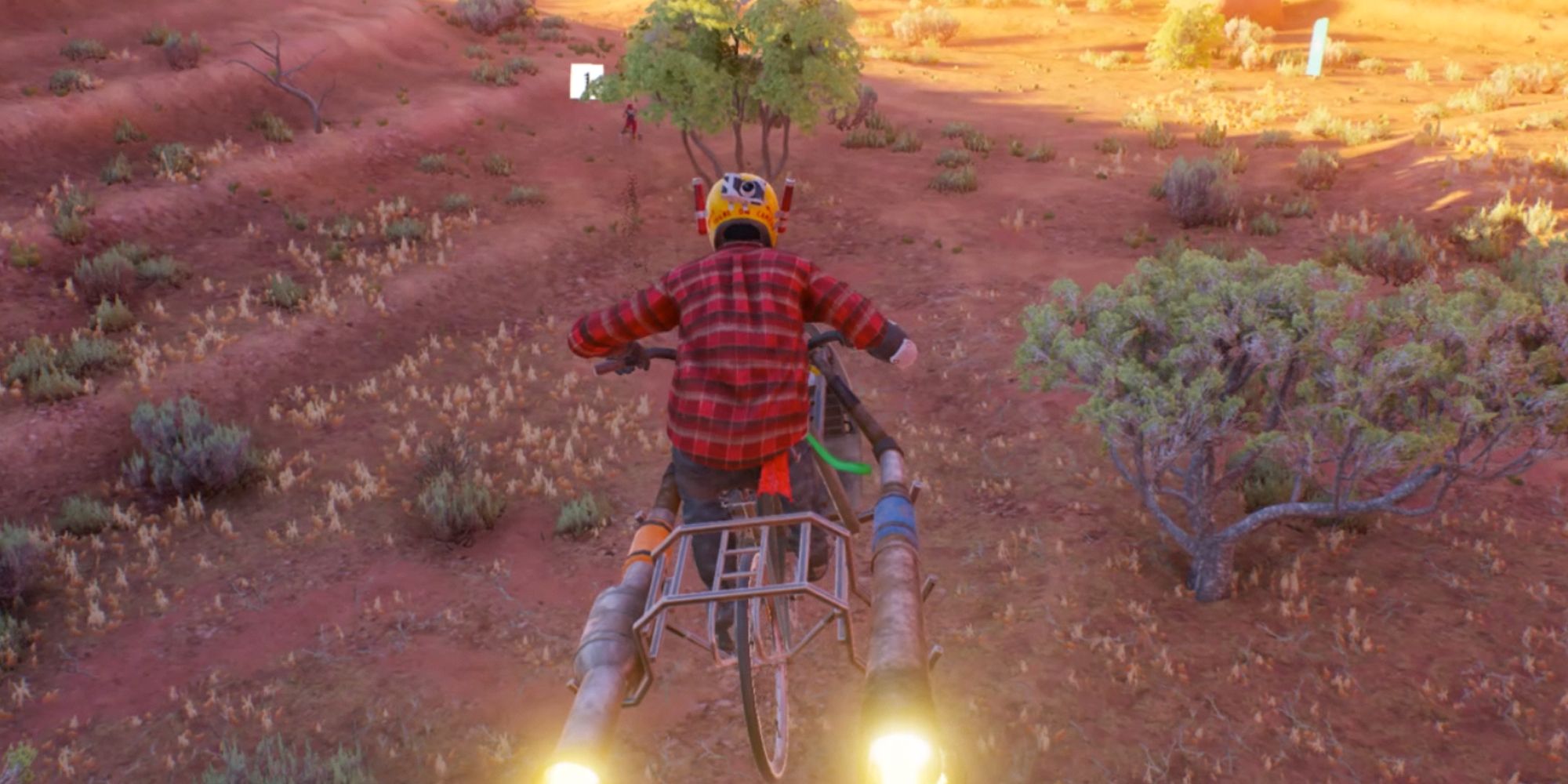 Riders Republic. Riding through the canyons wearing a yellow helmet.