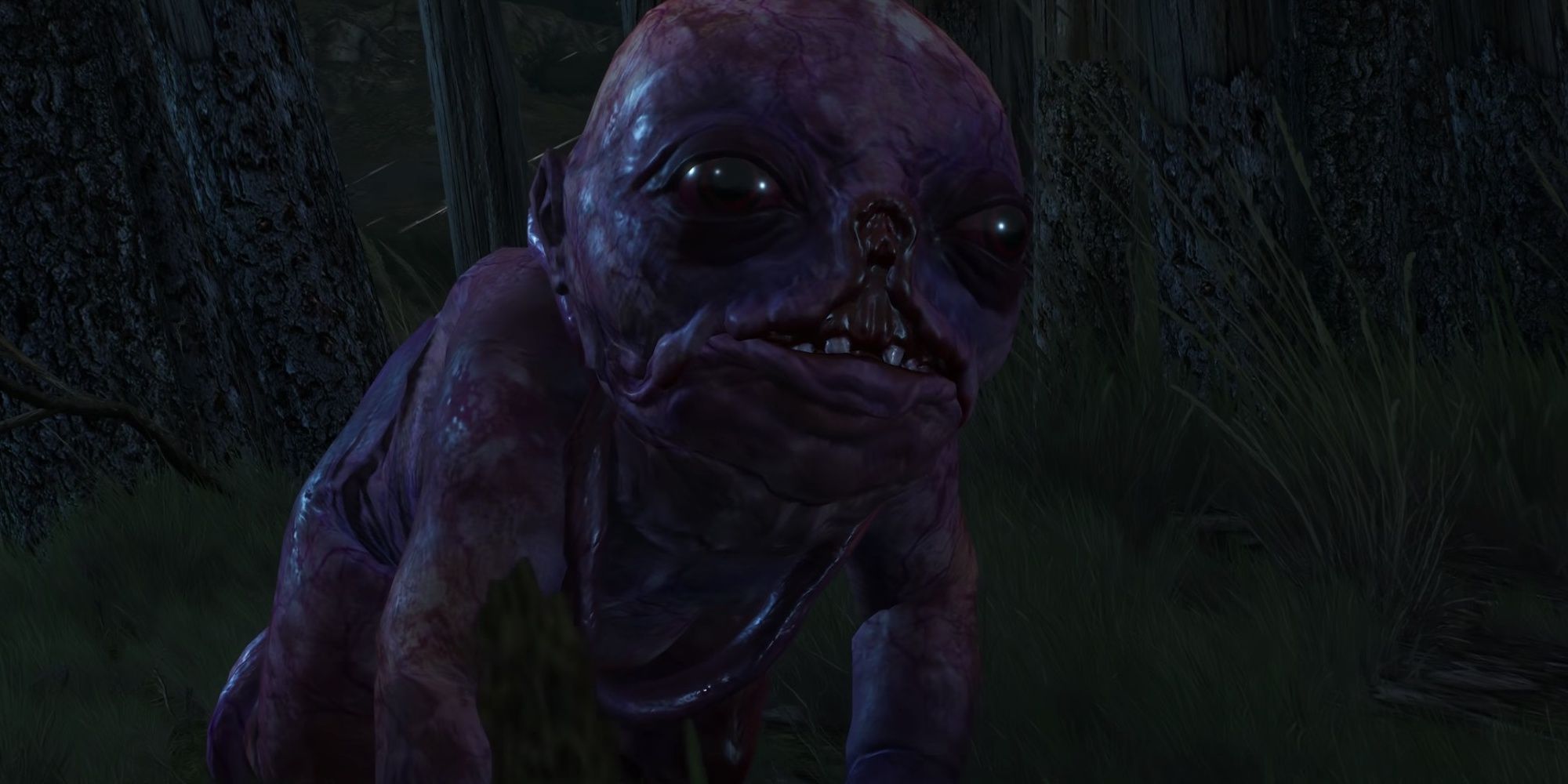 A monster resembling an overgrown infant crawls across the ground on a dark night.