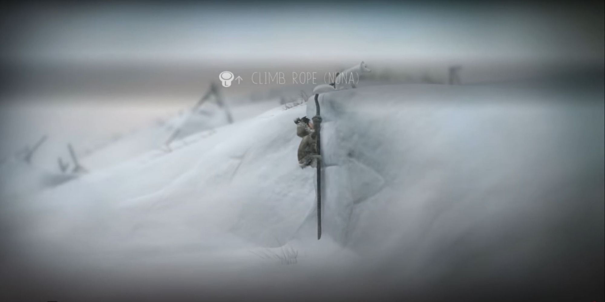 Fox lowers a rope for Nuna to climb a tall icy wall
