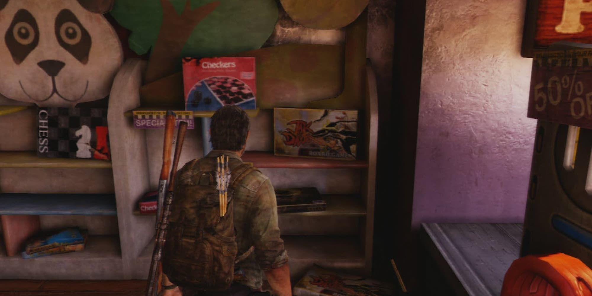 Joel looking at a Jak and Daxter board game in a toy shop