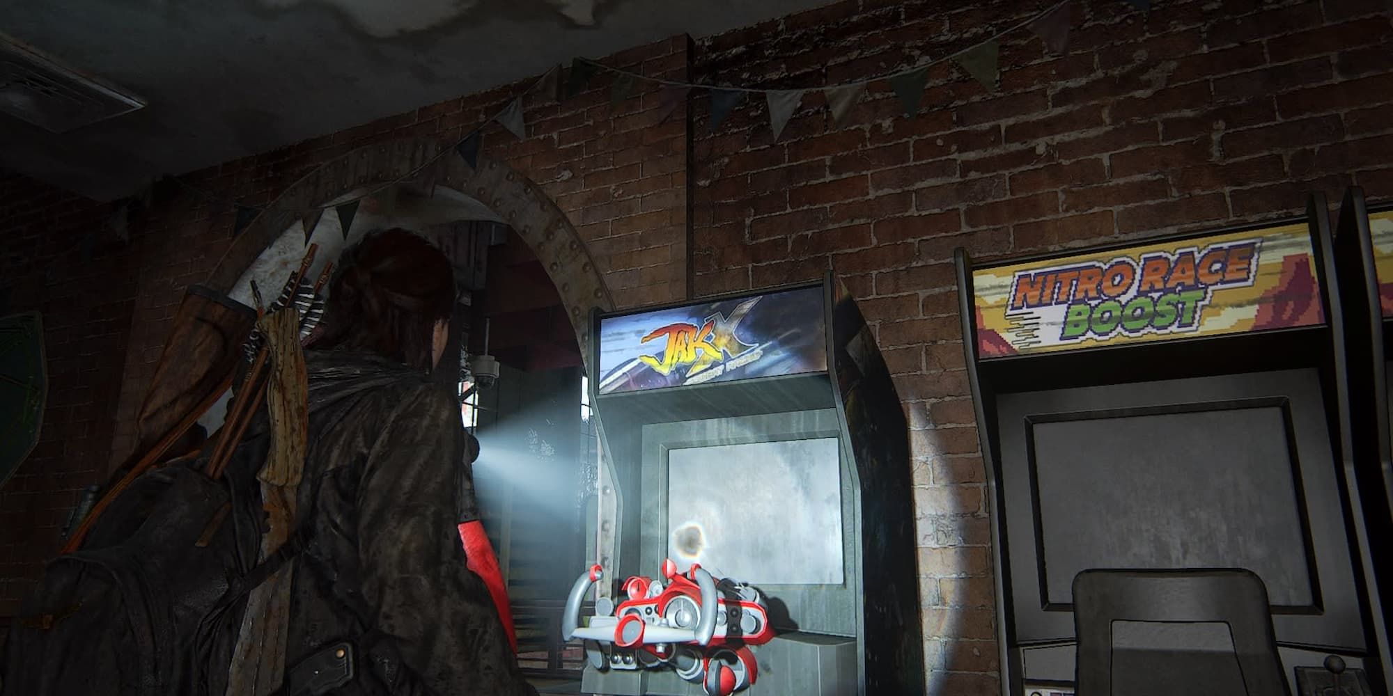 Ellie looking at a Jak X arcade machine