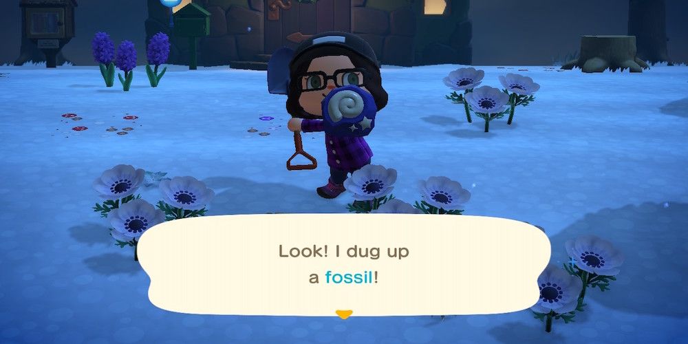 Animal Crossing character holds up fossil found using a shovel in the snow