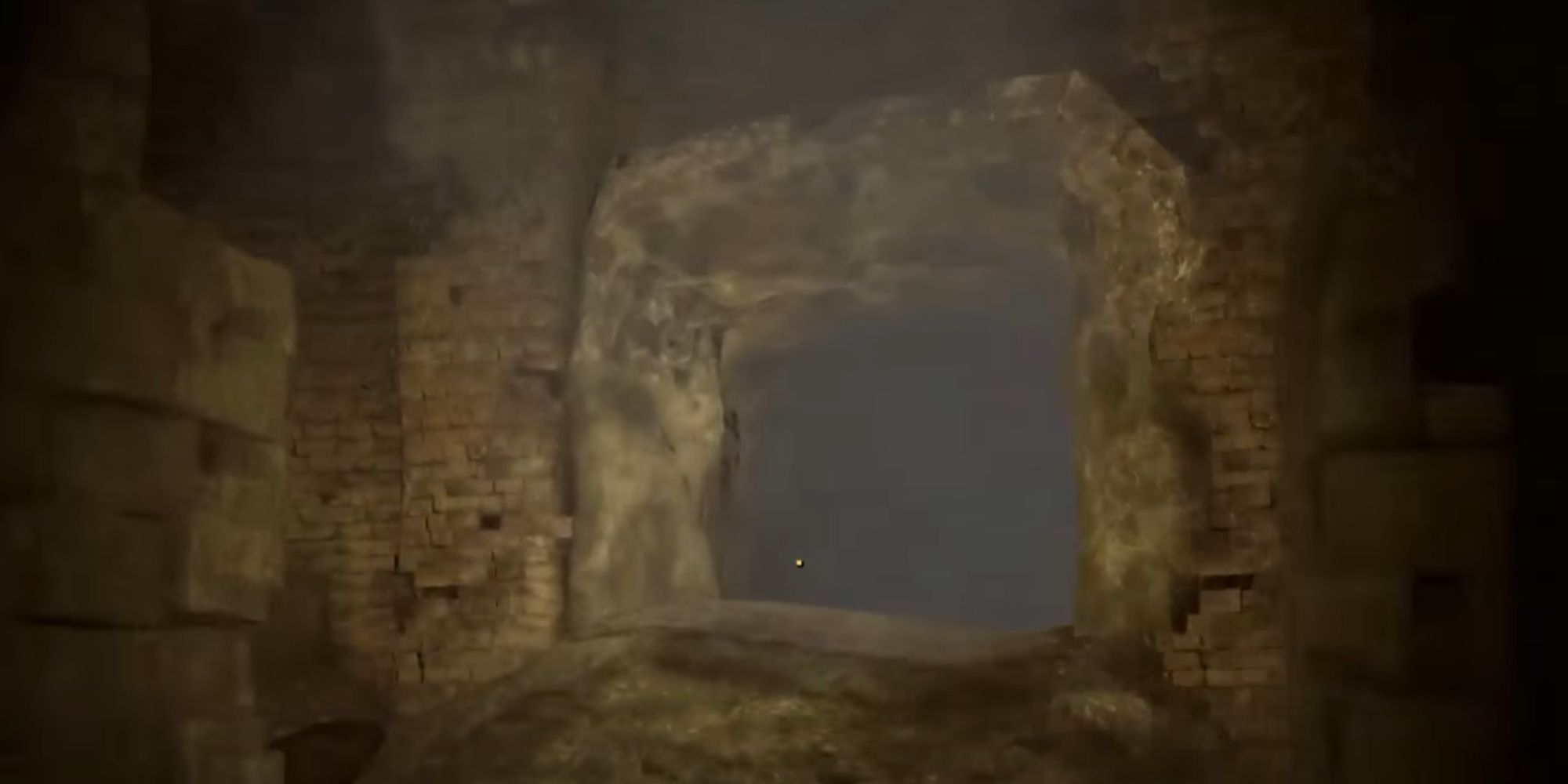 A screenshot of a cave with fog.