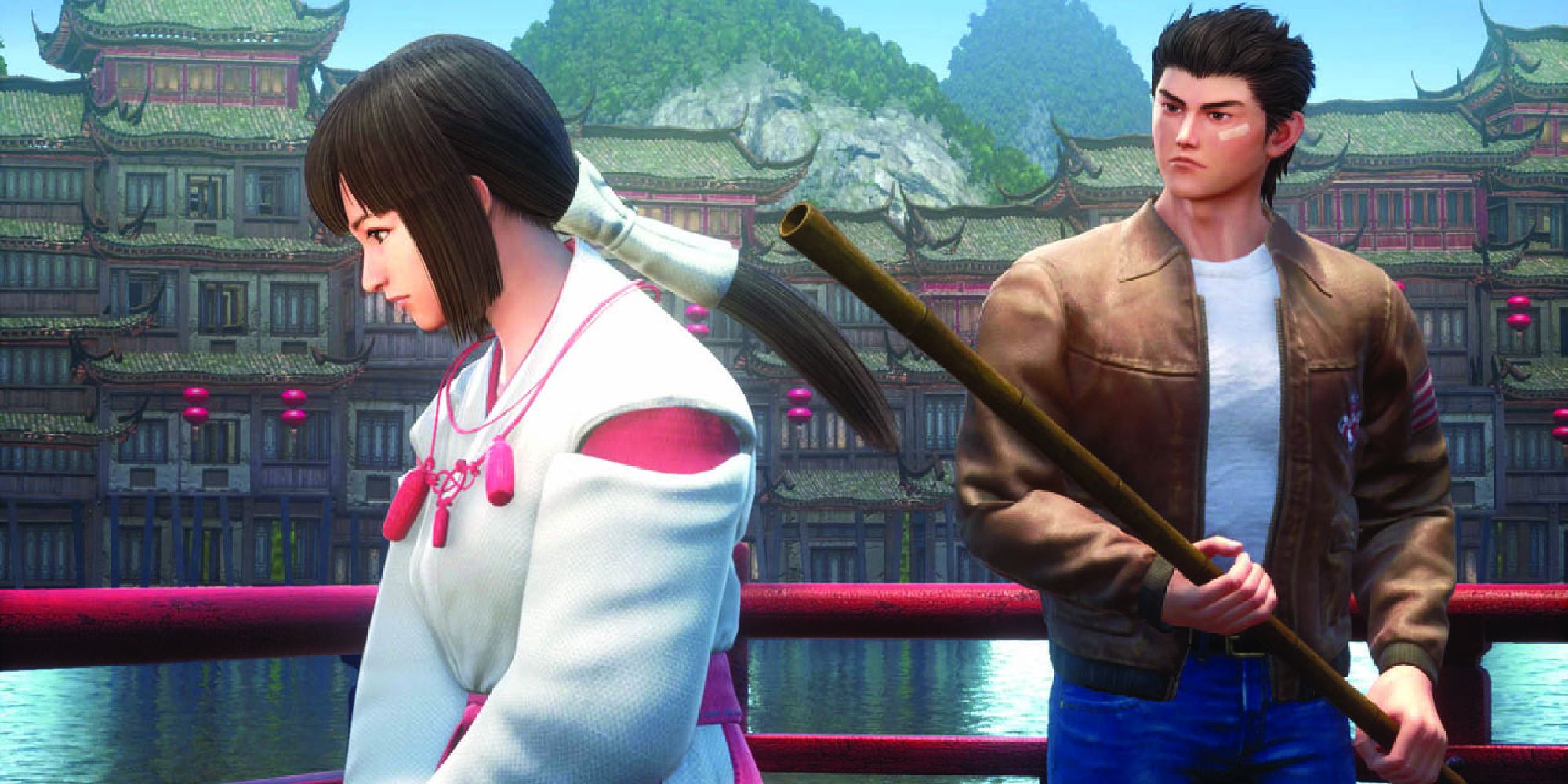 Ryo Hazuki holds a staff to the head of a female opponent in Shenmue 3