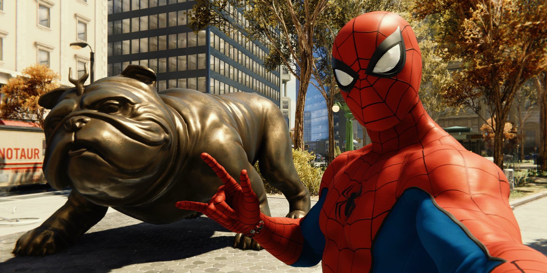 Spider-Man poses in front of a Lockjaw statue
