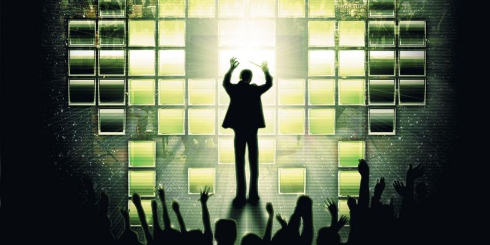 Video Game Orchestra - Video Games Live - A Conductor On Stage In Front Of A Cheering Crowd