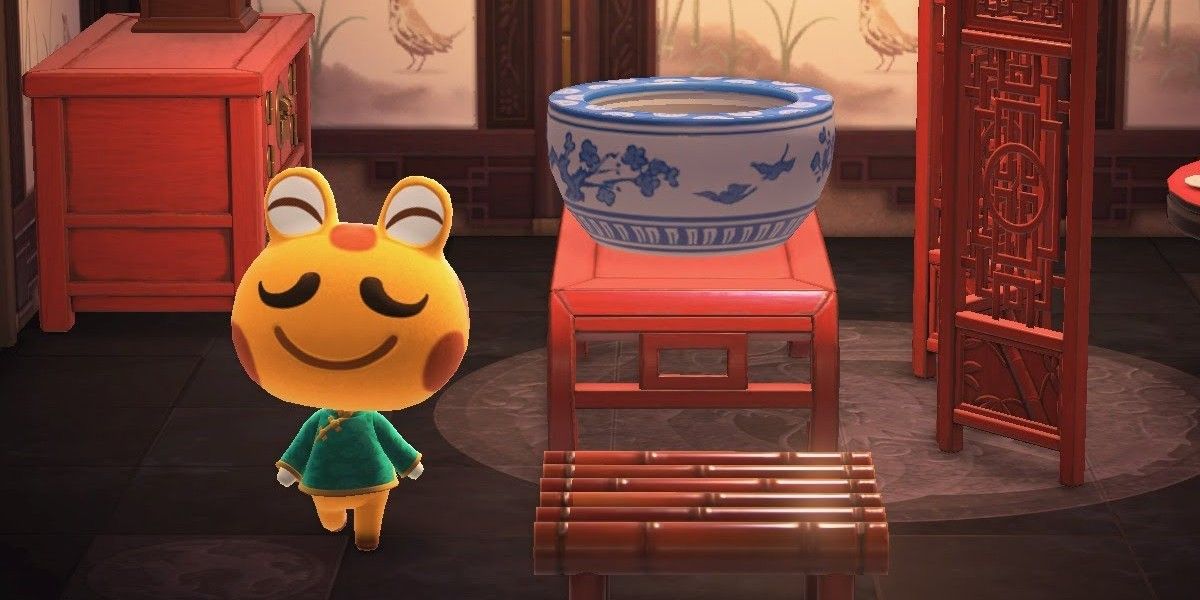 animal crossing new horizons Cousteau frog villager in his home