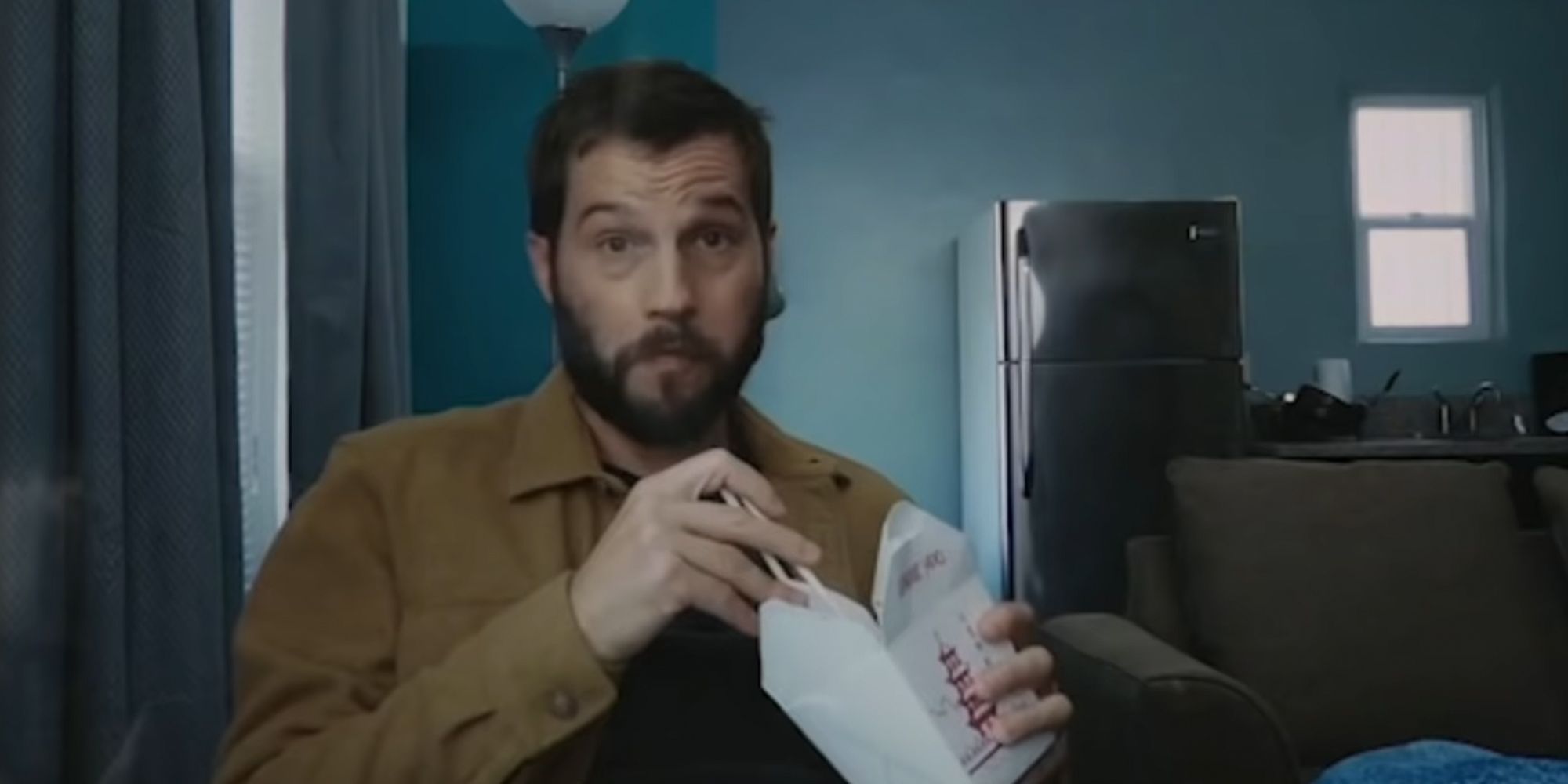 Telling Lies. David eating Chinese takeout while recording a video.