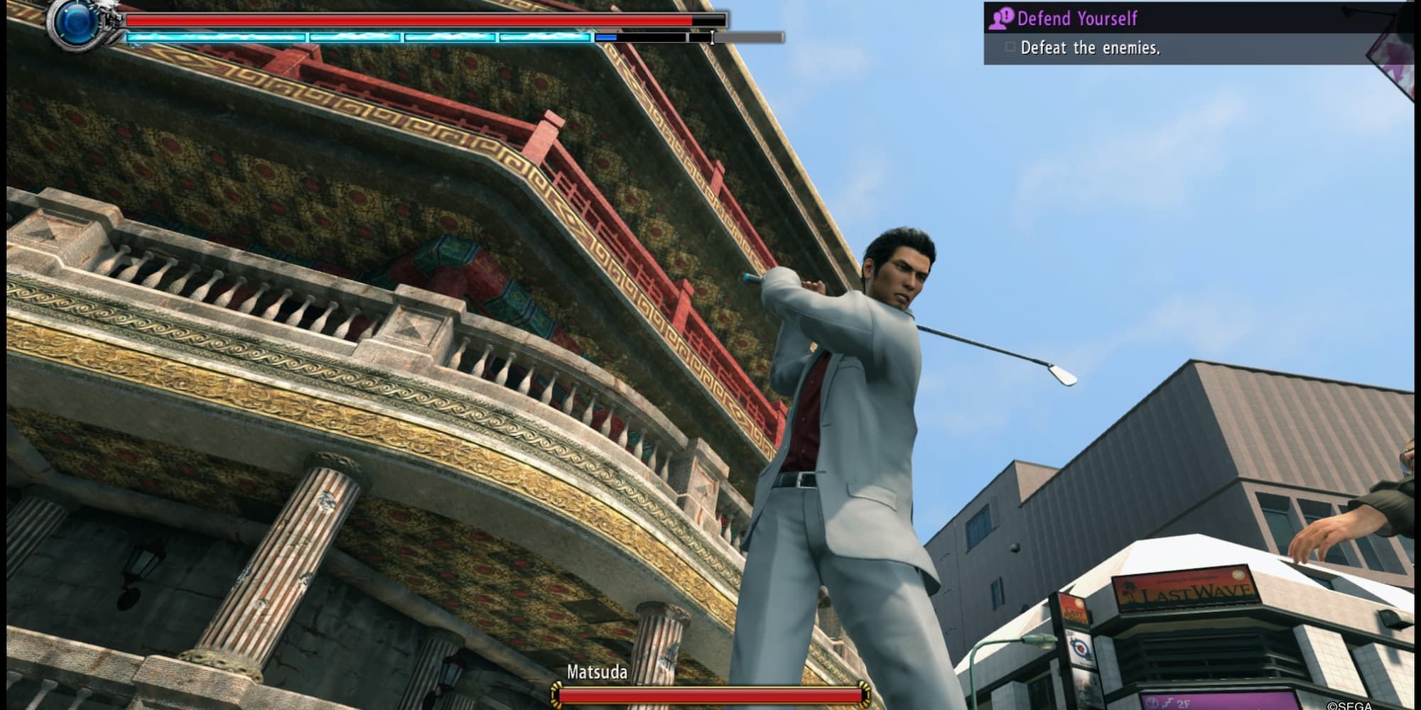 Kiryu preparing to use a heat action with a golf club outside an ornately decorated building