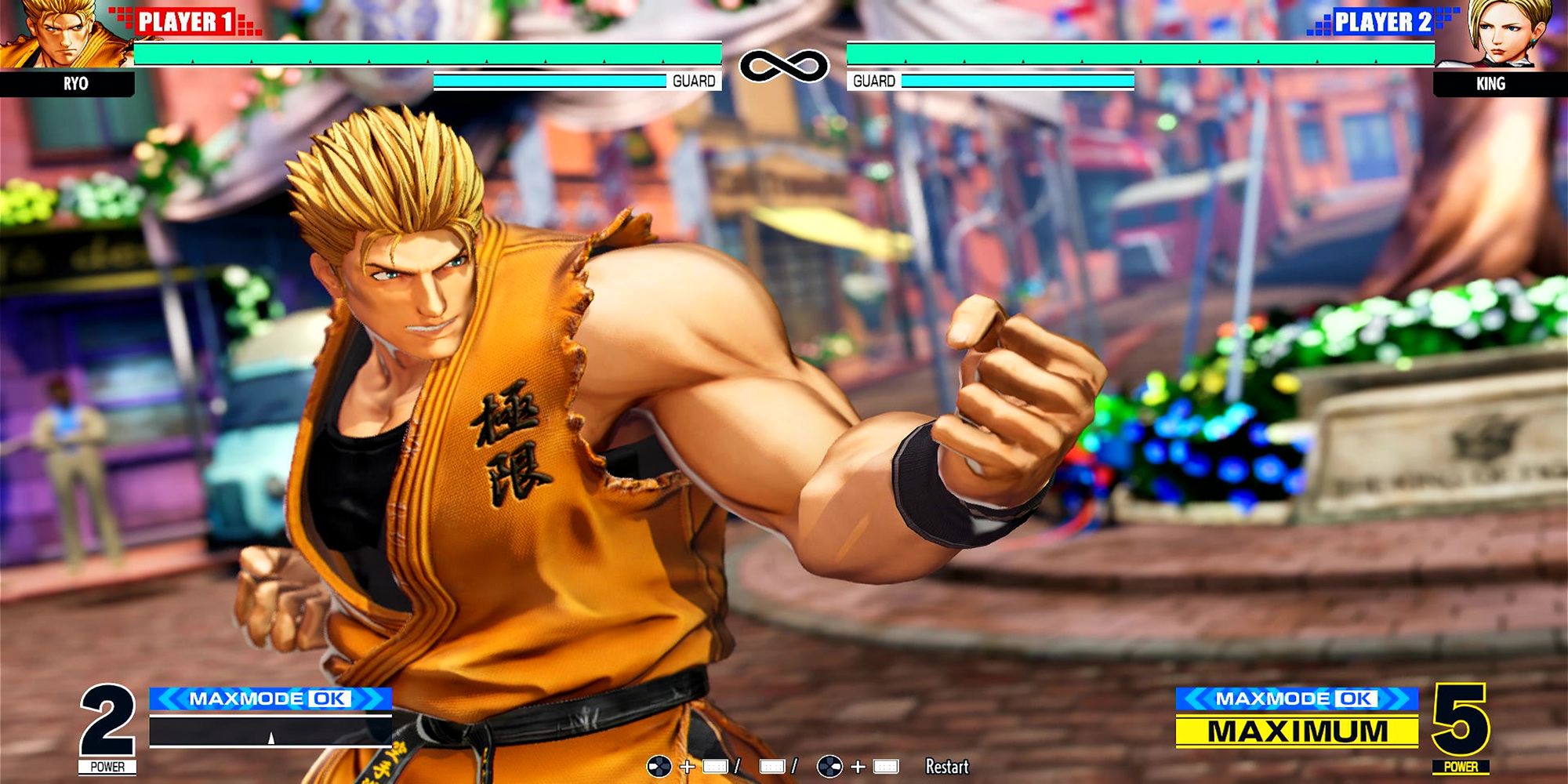Ryo prepares to hit King with his Climax Super Special Move, the Shin - Tenchi Haoh Ken, at a match on Provence Main Street in The King Of Fighters 15.