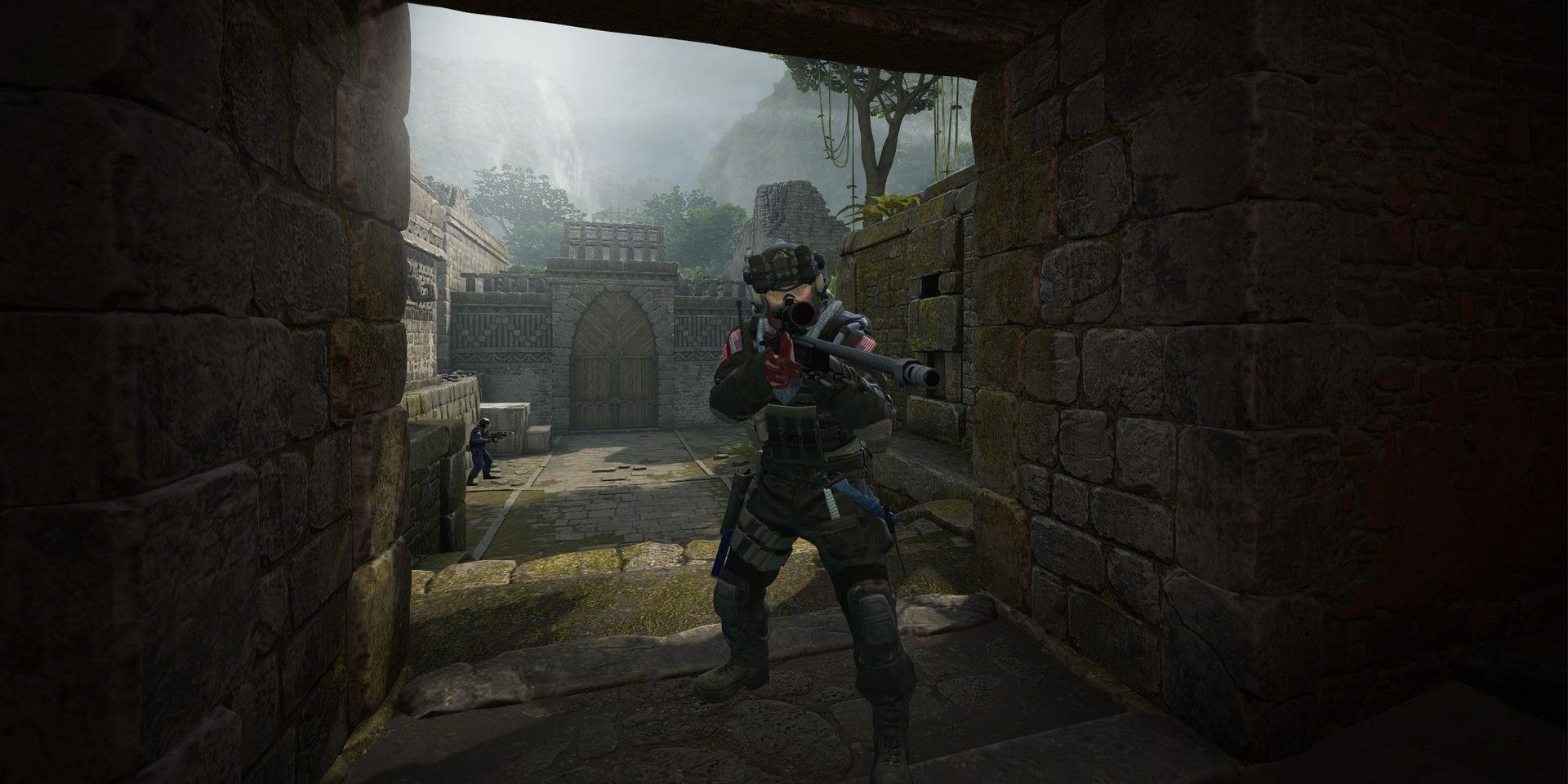 A screenshot showing a player camping in a dark passage in Counter-Strike:Global Offensive