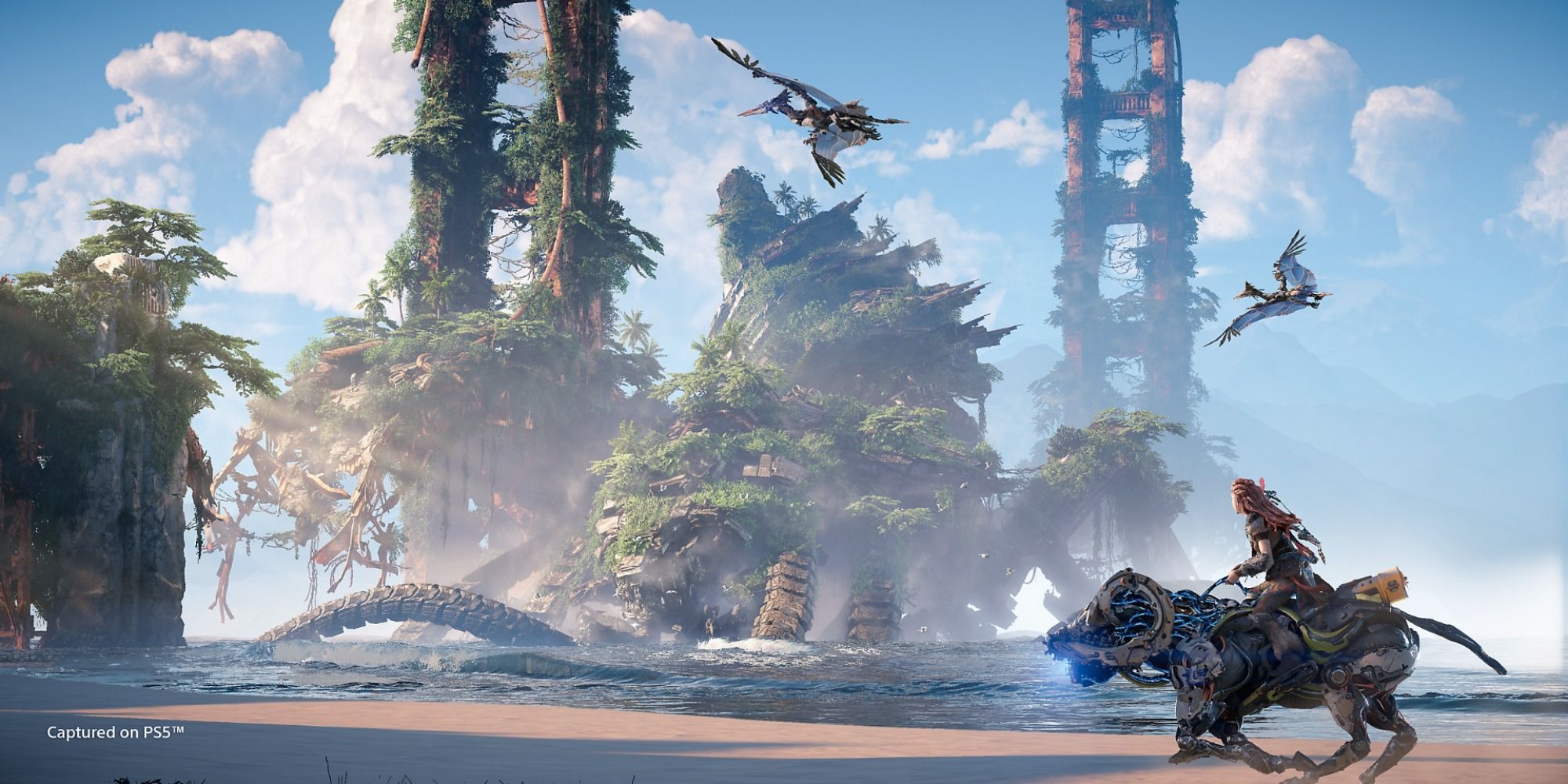 A screenshot showing Aloy riding past old ruins in Horizon Forbidden West