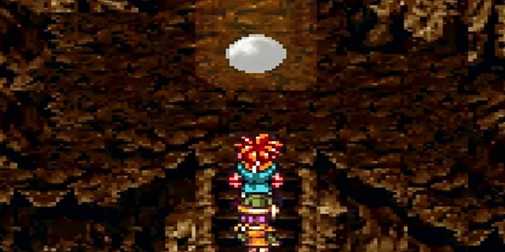 A screenshot of Crono and Lucca walking towards the Sun Stone in Chrono Trigger.