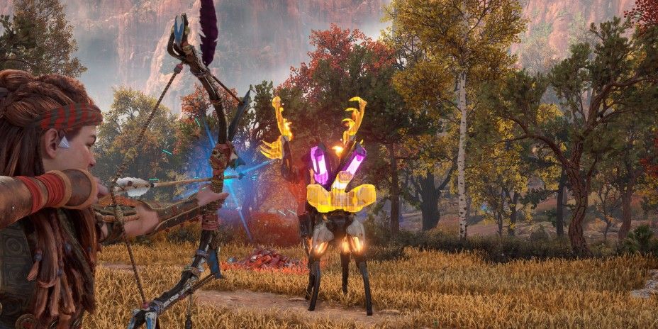 Aloy hunting a Fire Fanghorn in Horizon Forbidden West 