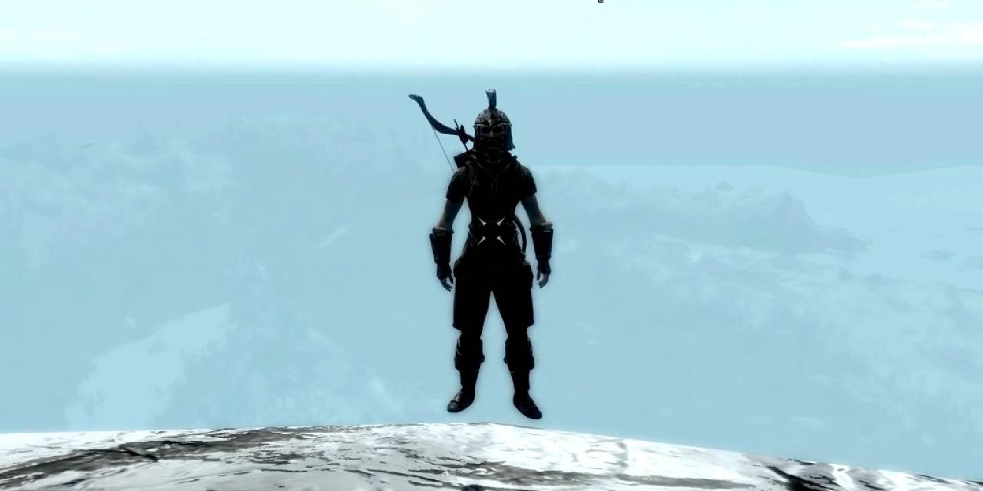 Lydia standing on the edge of a mountain