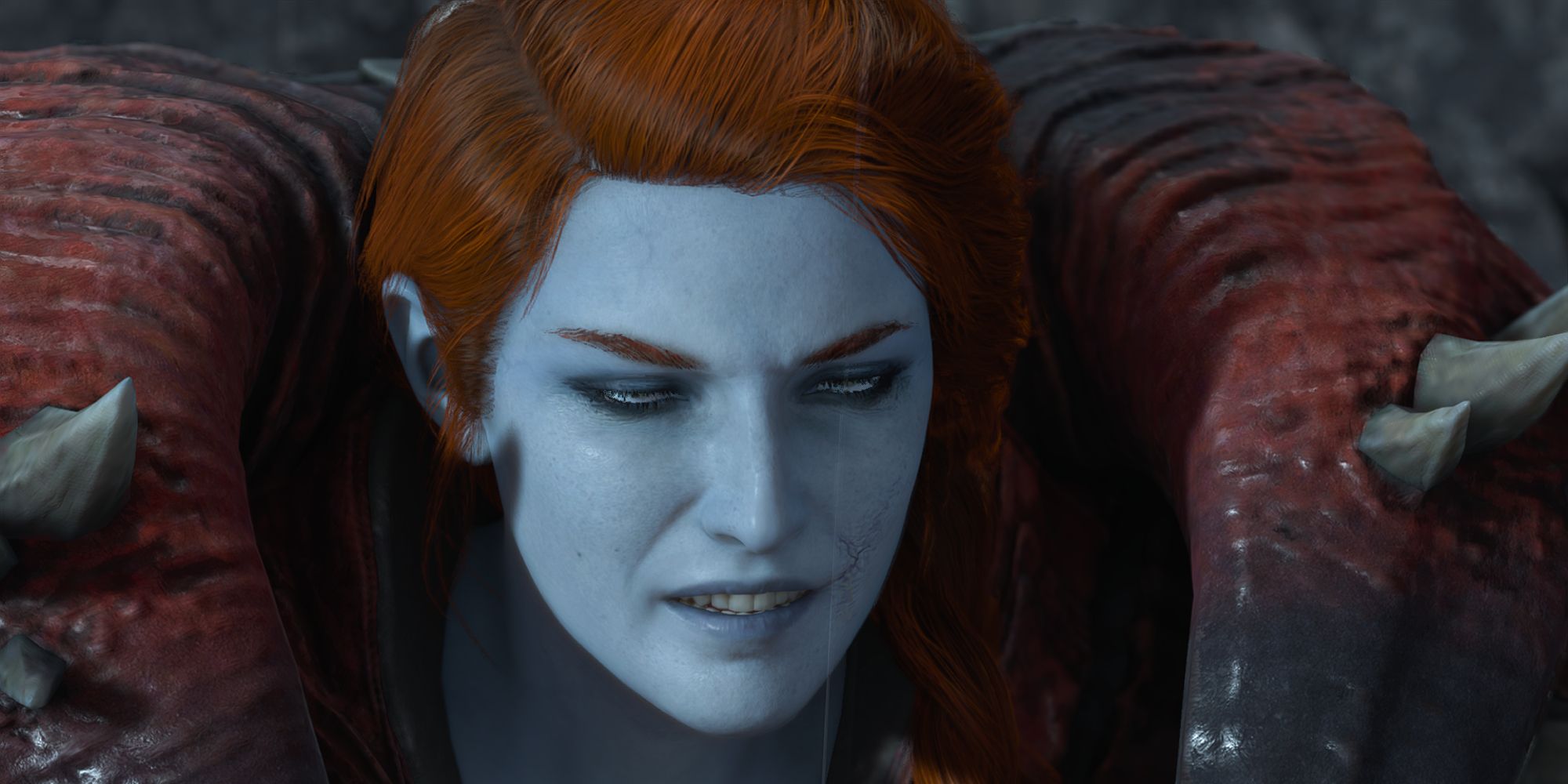 a close up of Lady Hellbender looking at something off camera with a grin on her face