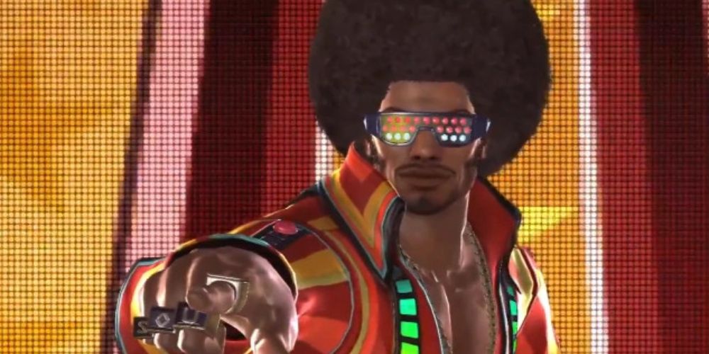 a mid shot of Tiger Jackson from Tekken against a colourful background pointing his finger at the viewer