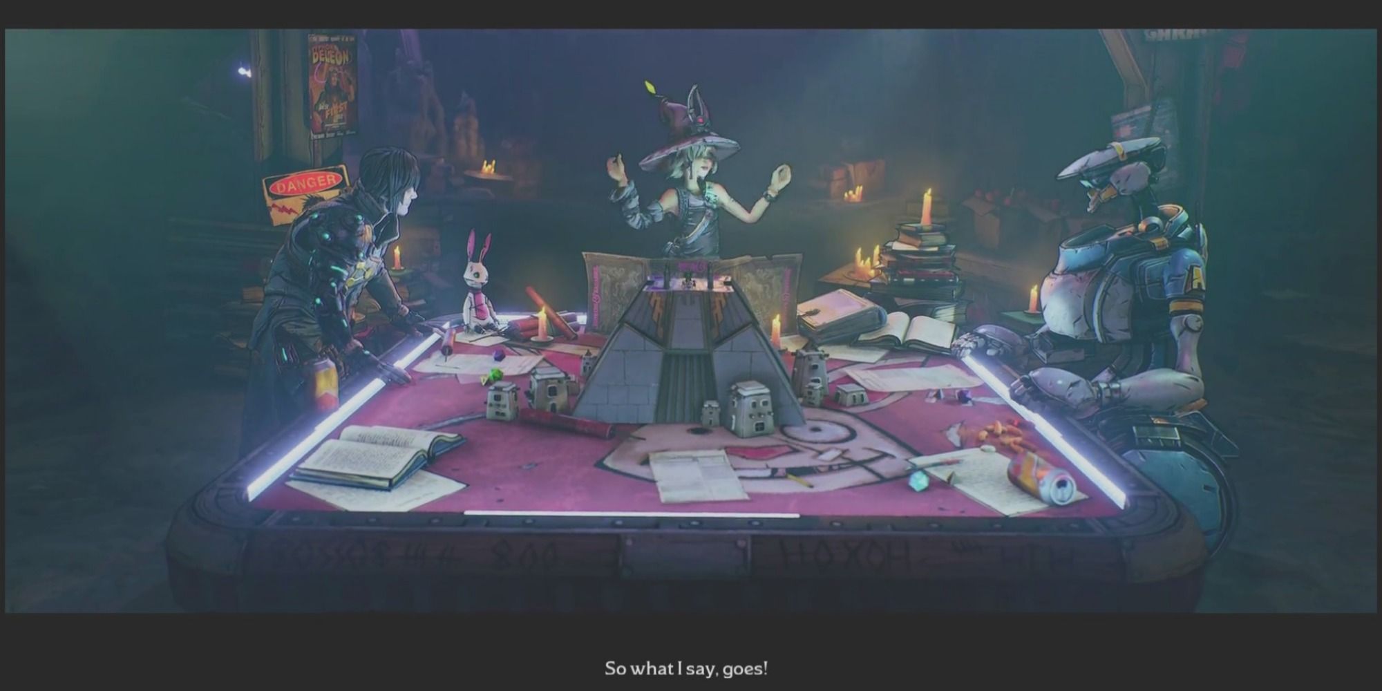 Tina, Valentine, and Frette sit a a glowing billiards table with a Bunkers and Badasses board set up