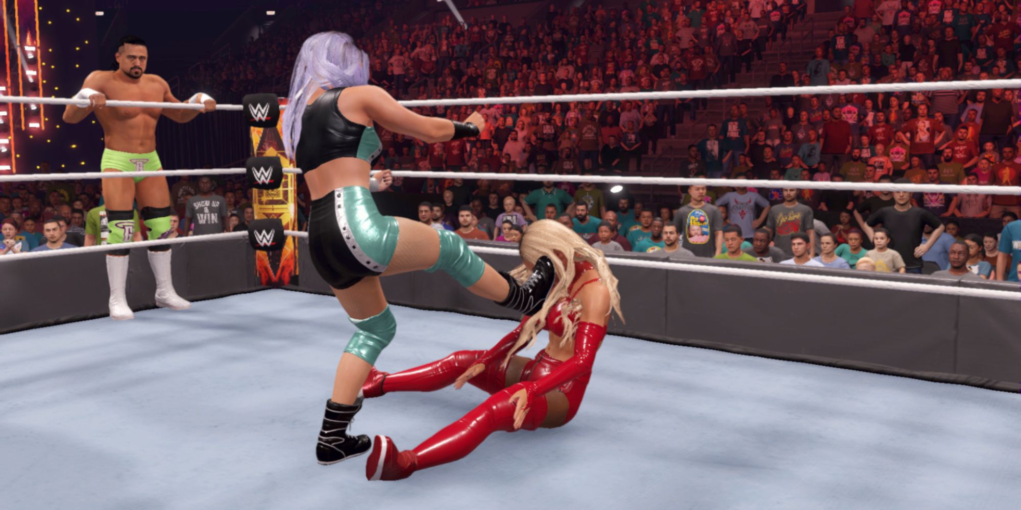 WWE 2K22 Screenshot Of Candice LeRae Kicking Carmella In Face