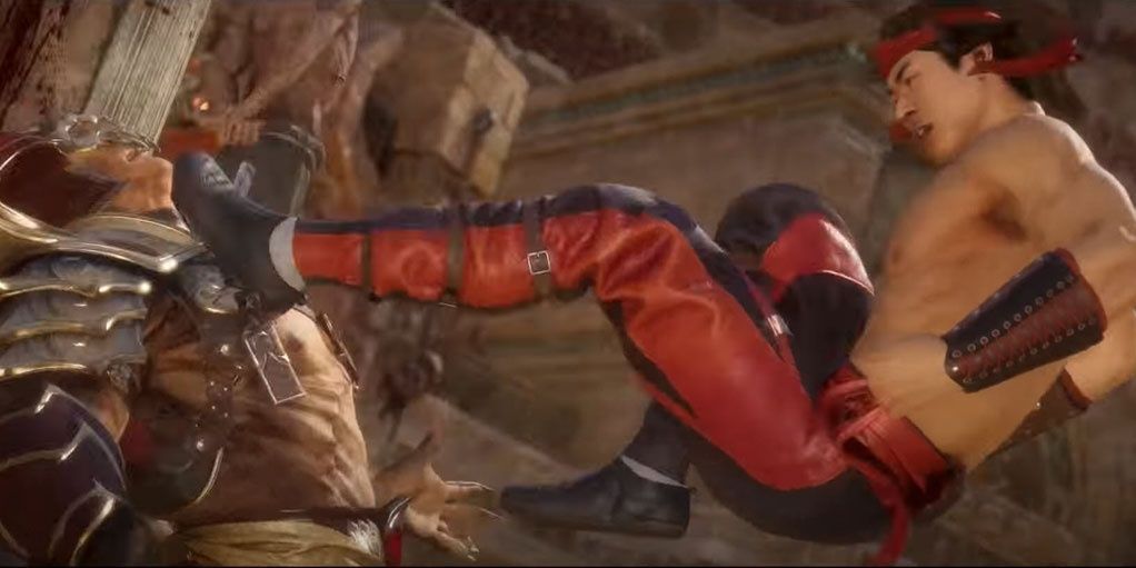 Liu King kicking Shao Khan Mortal Kombat 11
