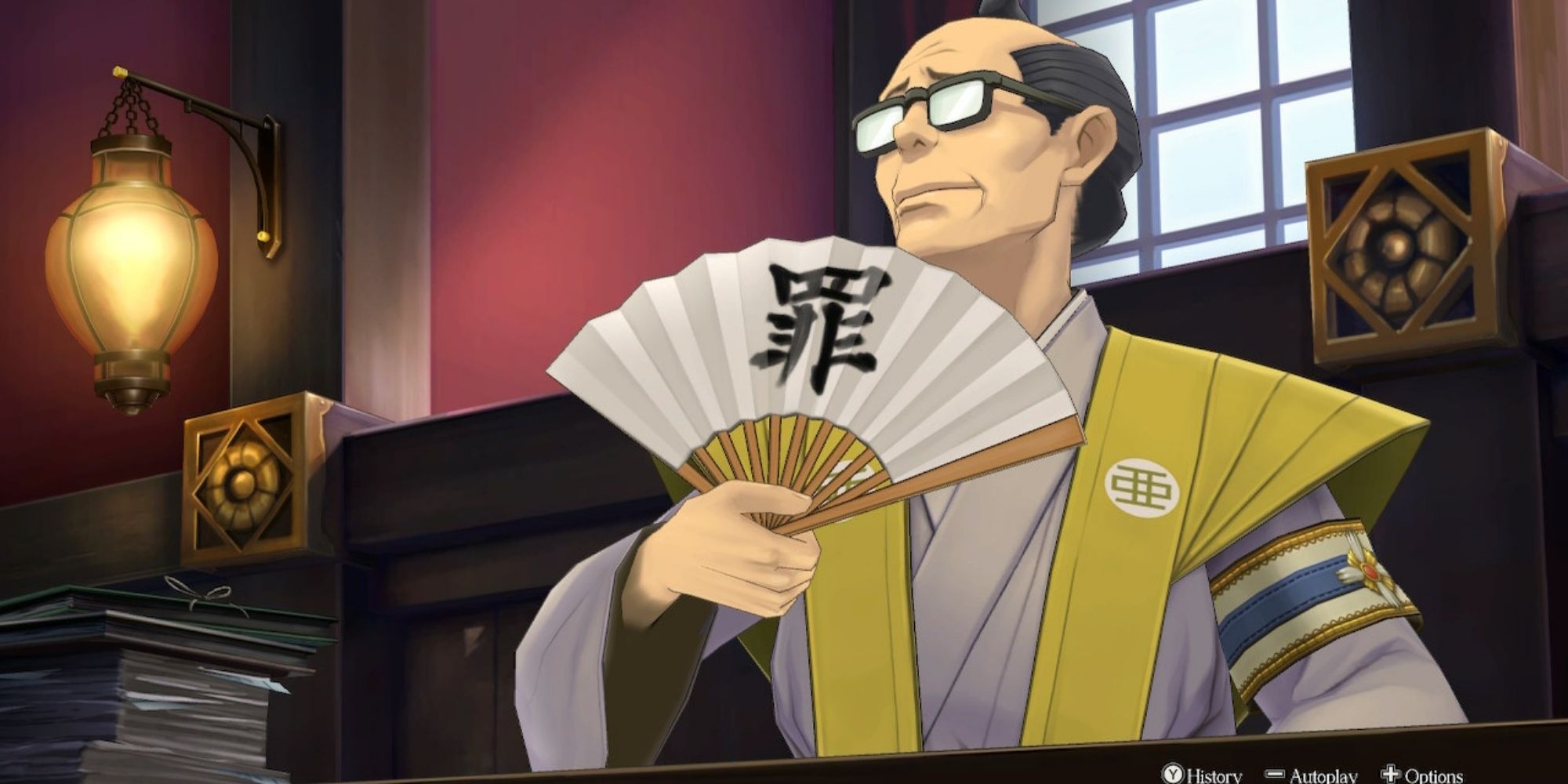 The Great Ace Attorney Chronicles Taketsuchi Auchi Holds A Fan Proudly Behind The Prosecutors Bench