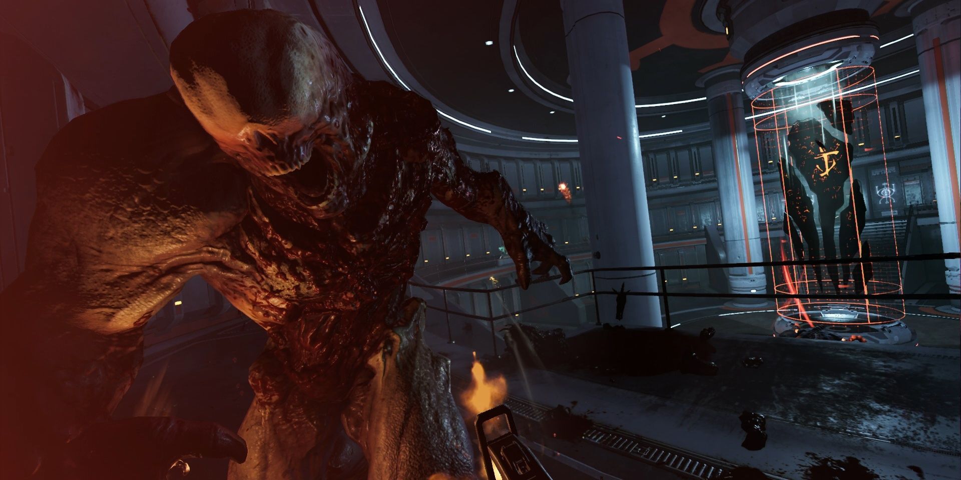 A screenshot showing gameplay in Doom VFR of a player shooting a demon in a lab facility.