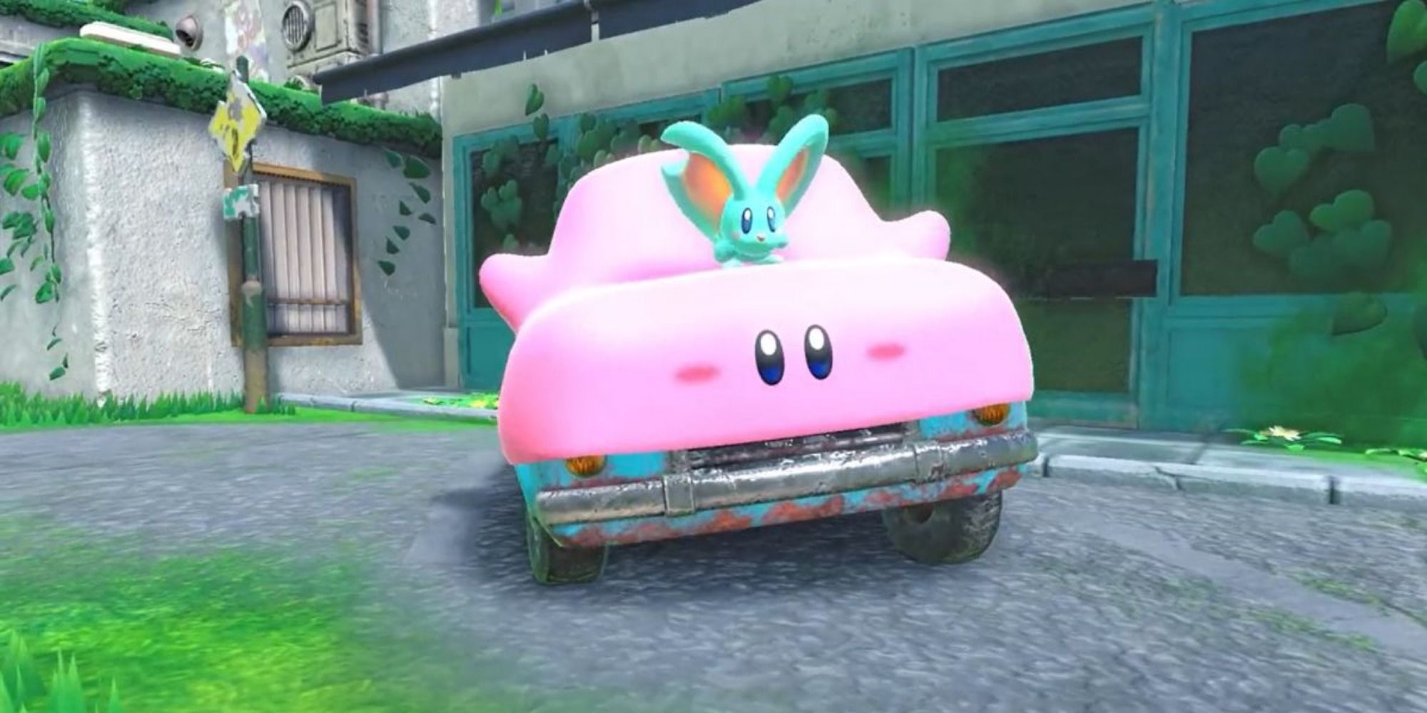 Kirby swallowed a car to drive around an overgrown city street, with Elfilin on his hood