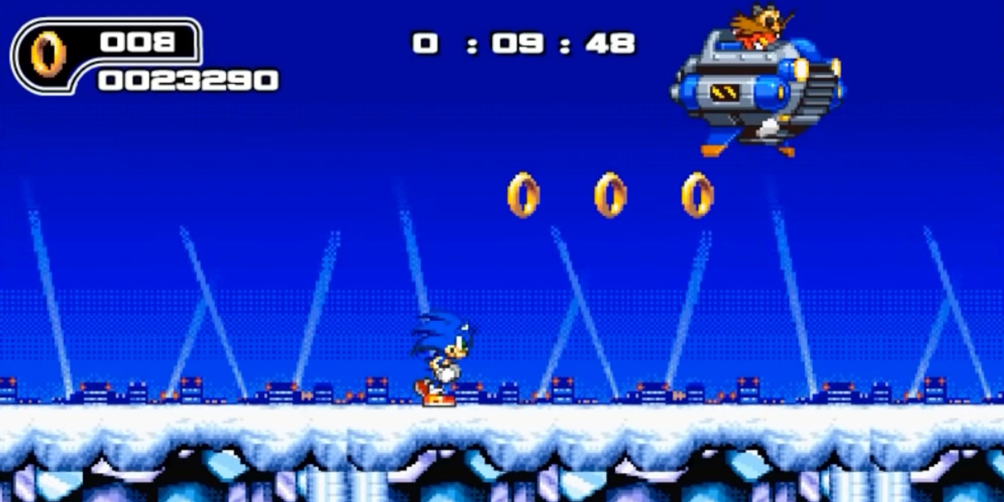 A screenshot from Ultimate Flash Sonic, showing Sonic fighting Dr. Eggman in a snowy landscape